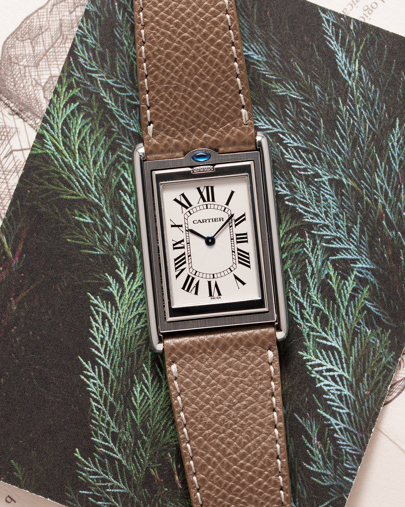  Brand: Cartier Year: 1999 Model: Tank Basculante Reference: 2390 Material: Stainless Steel Movement: Piguet-derived Cartier cal. 050 MC Case Diameter: 26 x 38mm Strap: Veblenist Taupe Grained Calf and Black Cartier Alligator with Cartier Stainless Steel Tang Buckle