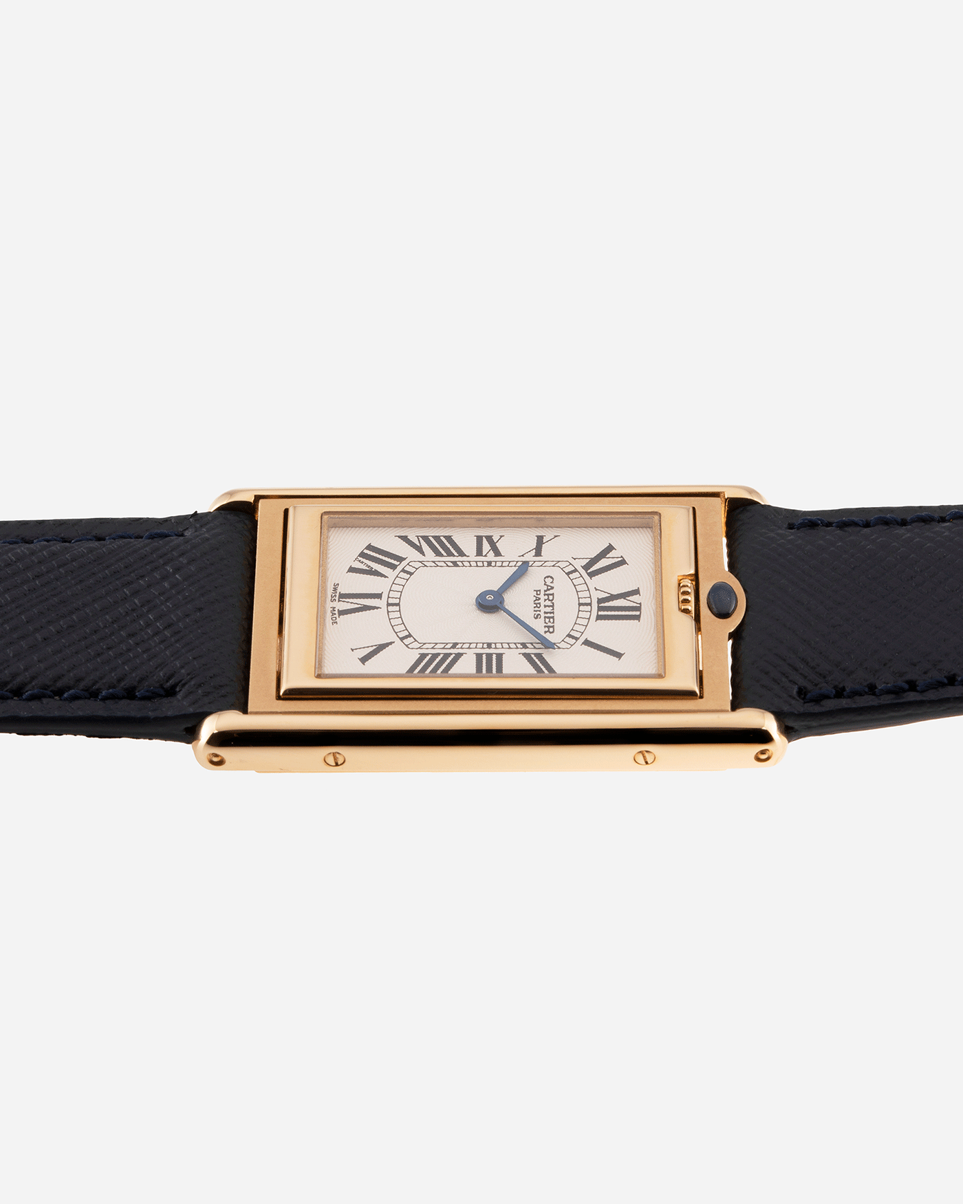 Brand: Cartier Year: 2000 Model: Tank Basculante Material: 18k Yellow Gold Movement: Cartier Cal. 610 (F. Piguet) Case Diameter: 25mm x 39mm Strap: Molequin Navy Blue Textured Calf and 18k Yellow Gold Deployant Clasp