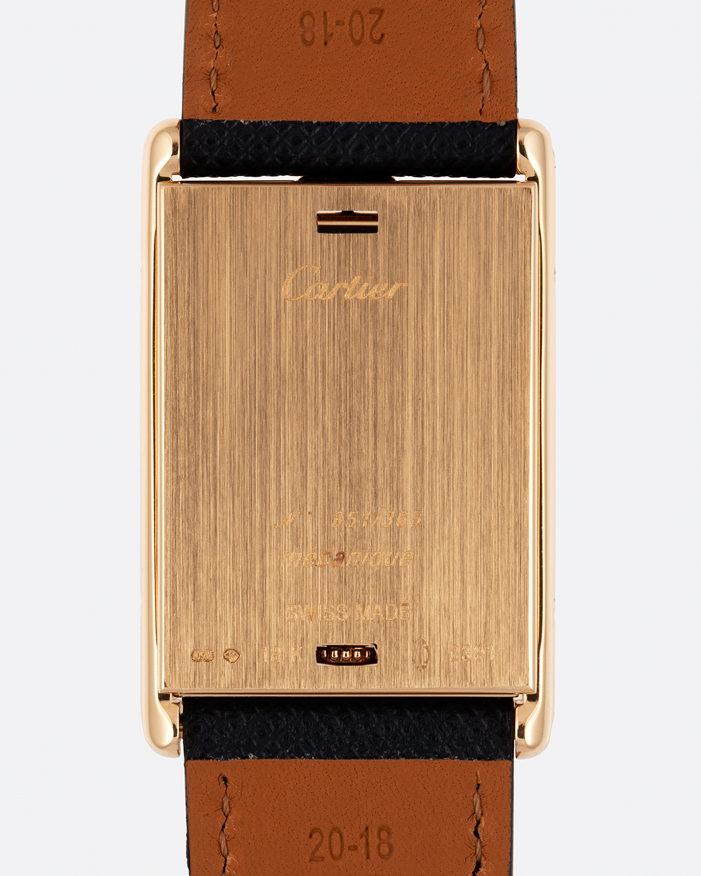 Brand: Cartier Year: 2000 Model: Tank Basculante Material: 18k Yellow Gold Movement: Cartier Cal. 610 (F. Piguet) Case Diameter: 25mm x 39mm Strap: Molequin Navy Blue Textured Calf and 18k Yellow Gold Deployant Clasp