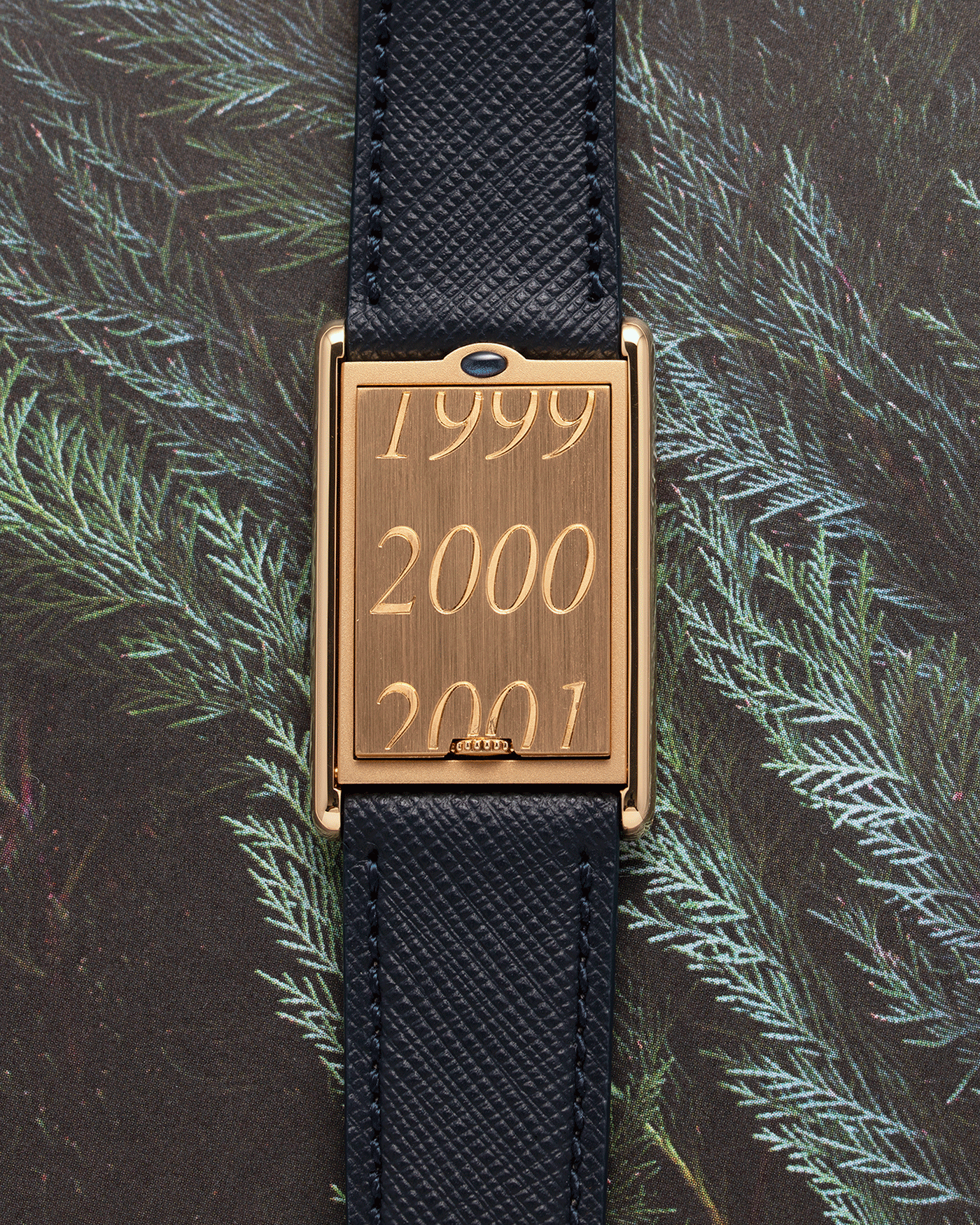 Brand: Cartier Year: 2000 Model: Tank Basculante Material: 18k Yellow Gold Movement: Cartier Cal. 610 (F. Piguet) Case Diameter: 25mm x 39mm Strap: Molequin Navy Blue Textured Calf and 18k Yellow Gold Deployant Clasp