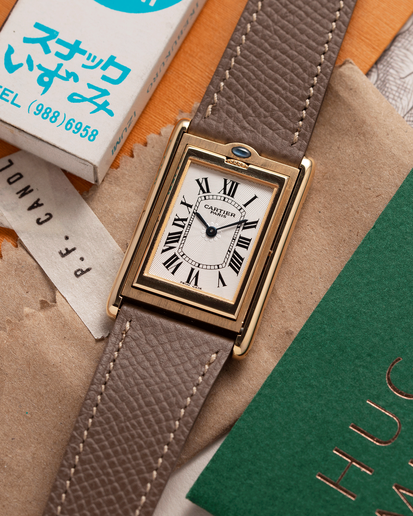 Brand: Cartier Year: 2001 Model: Tank Basculante Material: 18k Yellow Gold Movement: Cartier Cal. 610 (F. Piguet) Case Diameter: 25mm x 39mm Strap: Nostime Taupe Textured Calf and 18k Yellow Gold Deployant Clasp