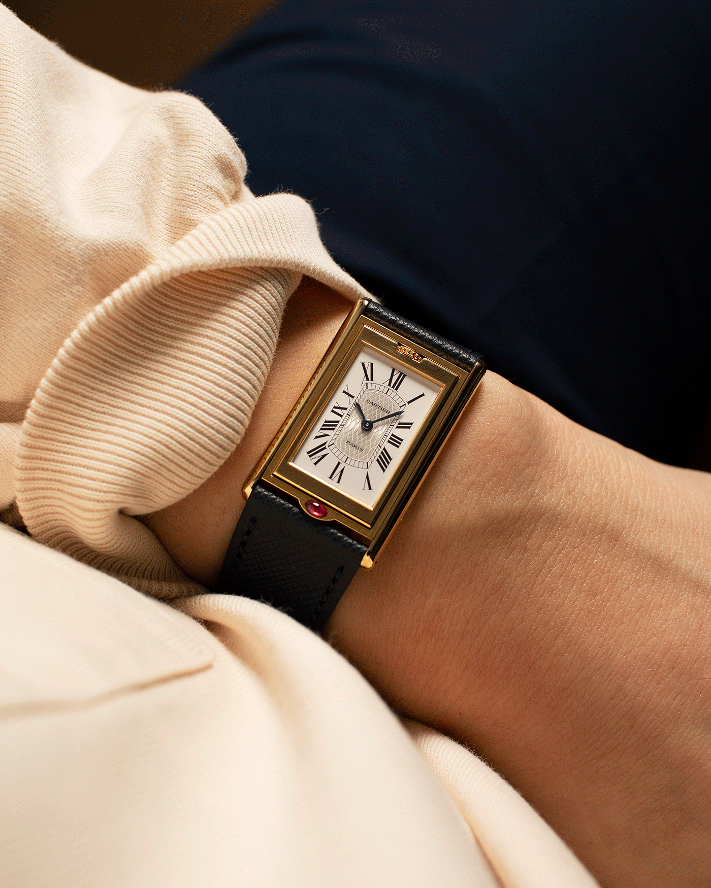 Brand: Cartier Year: 1997 Model: Tank Basculante ‘I Love Cartier’ 150th Anniversary Material: 18k Yellow Gold Movement: Cartier Cal. 610 (F. Piguet) Case Diameter: 22 x 38mm Strap: Navy Blue Molequin Textured Calf Strap with separate 18k Yellow Gold Cartier Tang Buckle