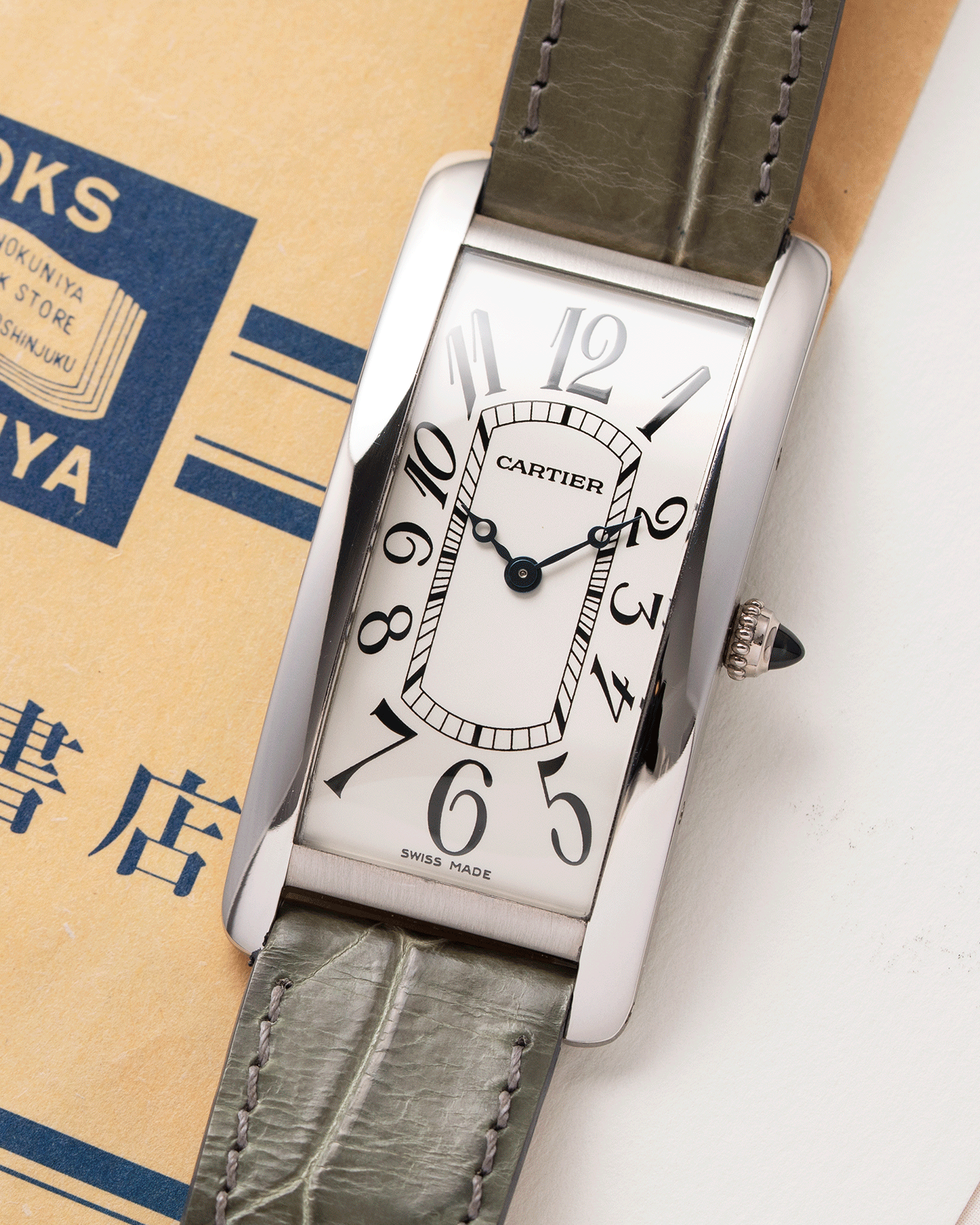Brand: Cartier Year: 2005 Model: CPCP Collection Prive Tank Cintree Reference: 2843 Material: Platinum Movement: Jaeger Le Coultre manual wind caliber 9770MC Case Diameter: 46 x 23 mm Strap: Moss Green Alligator Strap with Platinum Cartier Deployant Clasp