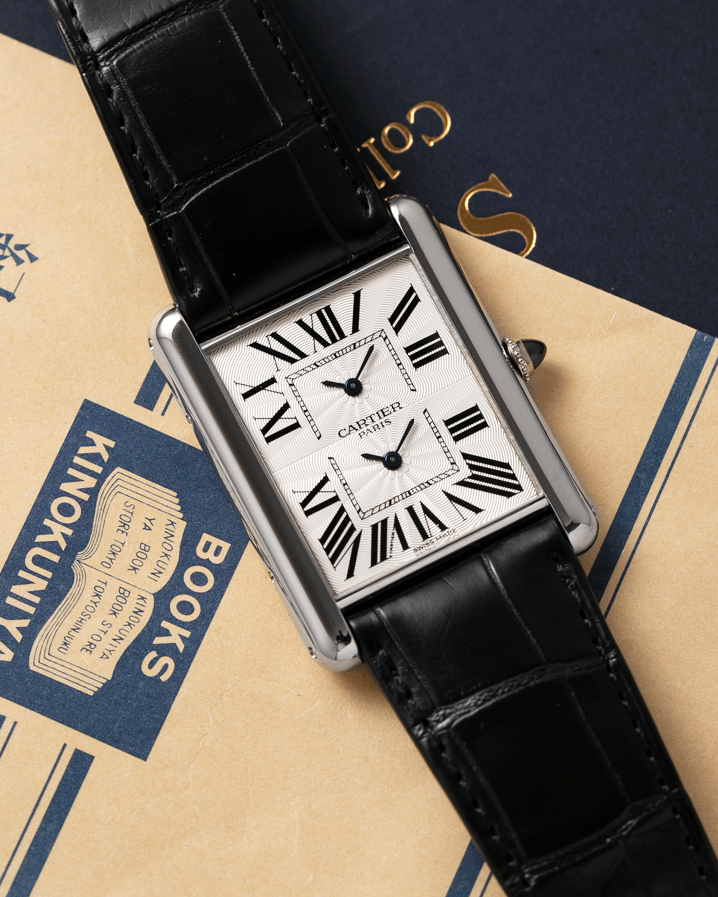 Brand: Cartier Year: 2010 Model: CPCP Tank Two Time Zone Reference: 2917 Material: 18k White Gold Movement: Piaget-Based Manually Wound Cal. 9901 MC Case Diameter: 29.3mm width, 38.3mm length Strap: Cartier Black Alligator Strap with 18k White Gold Cartier Deployant Clasp