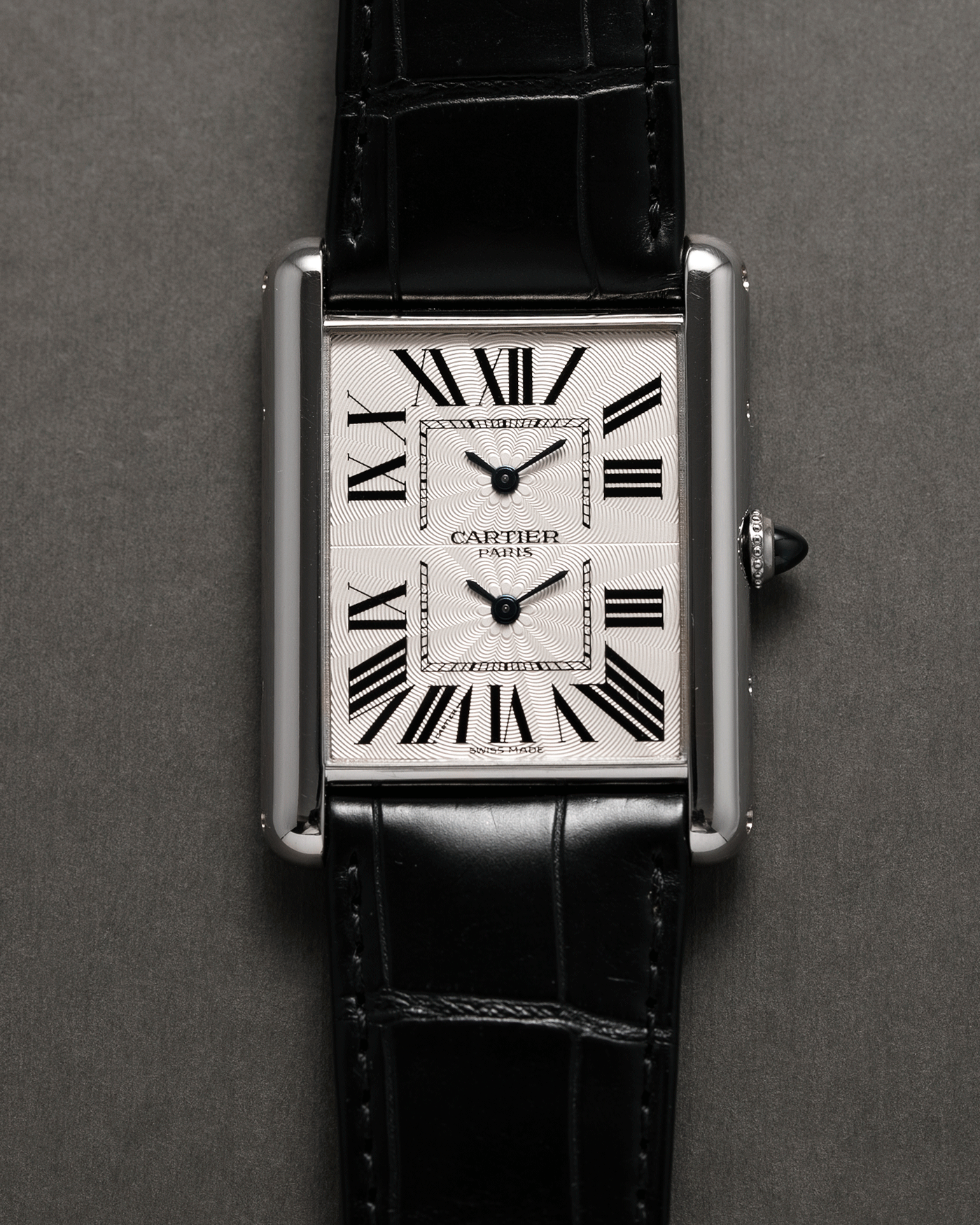 Brand: Cartier Year: 2010 Model: CPCP Tank Two Time Zone Reference: 2917 Material: 18k White Gold Movement: Piaget-Based Manually Wound Cal. 9901 MC Case Diameter: 29.3mm width, 38.3mm length Strap: Cartier Black Alligator Strap with 18k White Gold Cartier Deployant Clasp