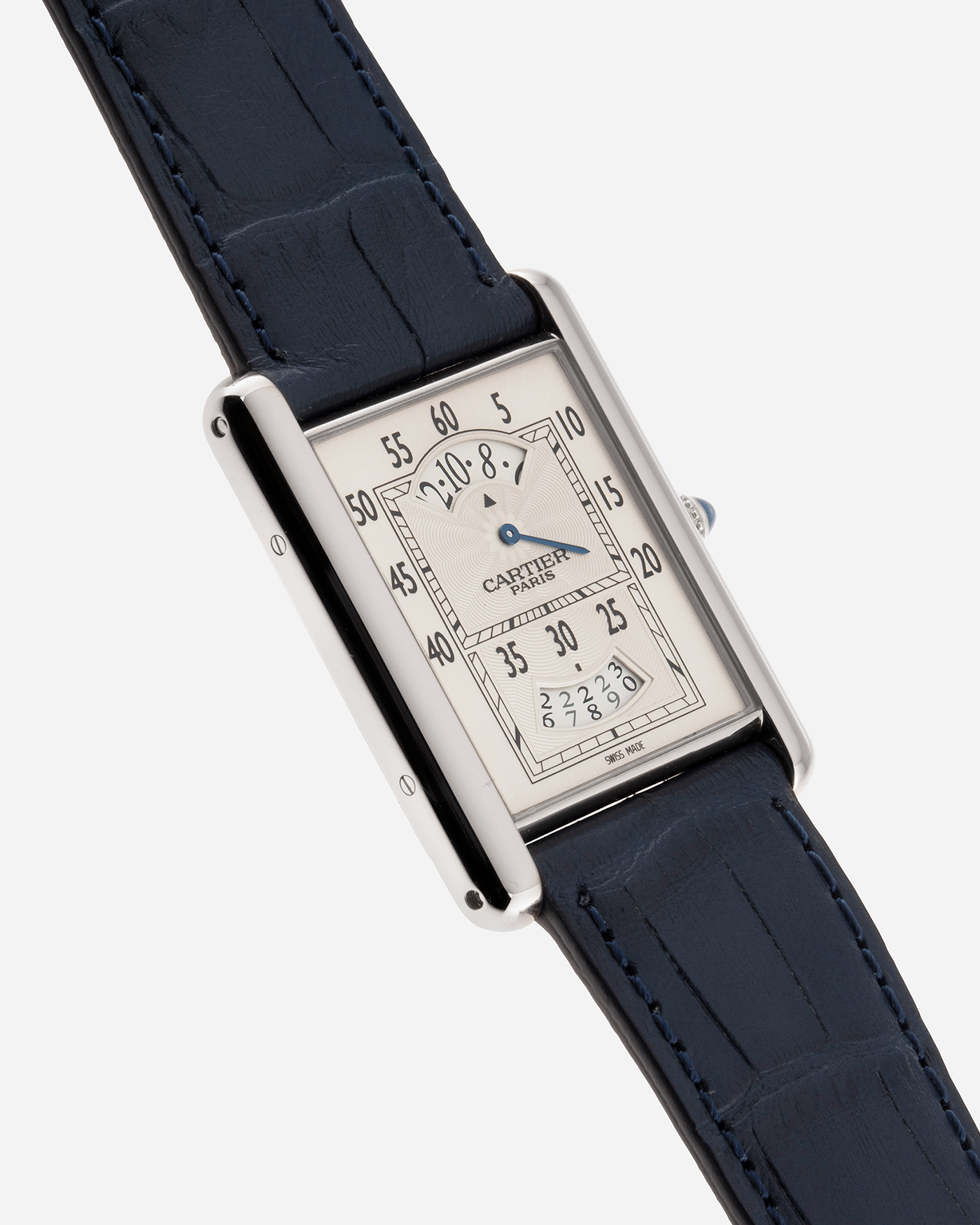 Brand: Cartier Year: 2000’s Model: Collection Prive Tank Louis Cartier Wandering Hours Reference: 2919 Material: 18k White Gold Movement: Piaget-Based Manually Wound Cal. 9902 MC Case Diameter: 28mm width, 40.5mm lug to lug Strap: Blue Cartier Alligator with 18k Cartier White Gold Deployant