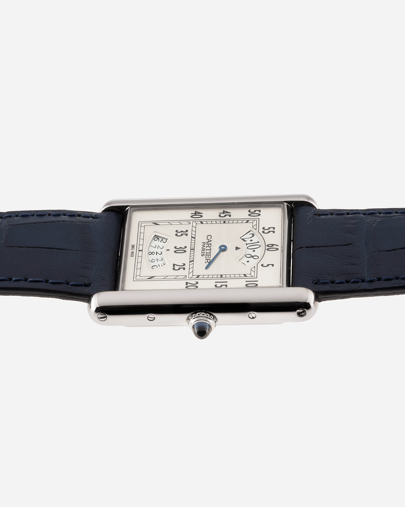 Brand: Cartier Year: 2000’s Model: Collection Prive Tank Louis Cartier Wandering Hours Reference: 2919 Material: 18k White Gold Movement: Piaget-Based Manually Wound Cal. 9902 MC Case Diameter: 28mm width, 40.5mm lug to lug Strap: Blue Cartier Alligator with 18k Cartier White Gold Deployant