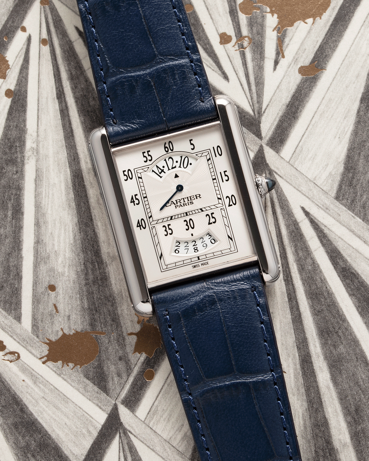 Brand: Cartier Year: 2000’s Model: Collection Prive Tank Louis Cartier Wandering Hours Reference: 2919 Material: 18k White Gold Movement: Piaget-Based Manually Wound Cal. 9902 MC Case Diameter: 28mm width, 40.5mm lug to lug Strap: Blue Cartier Alligator with 18k Cartier White Gold Deployant