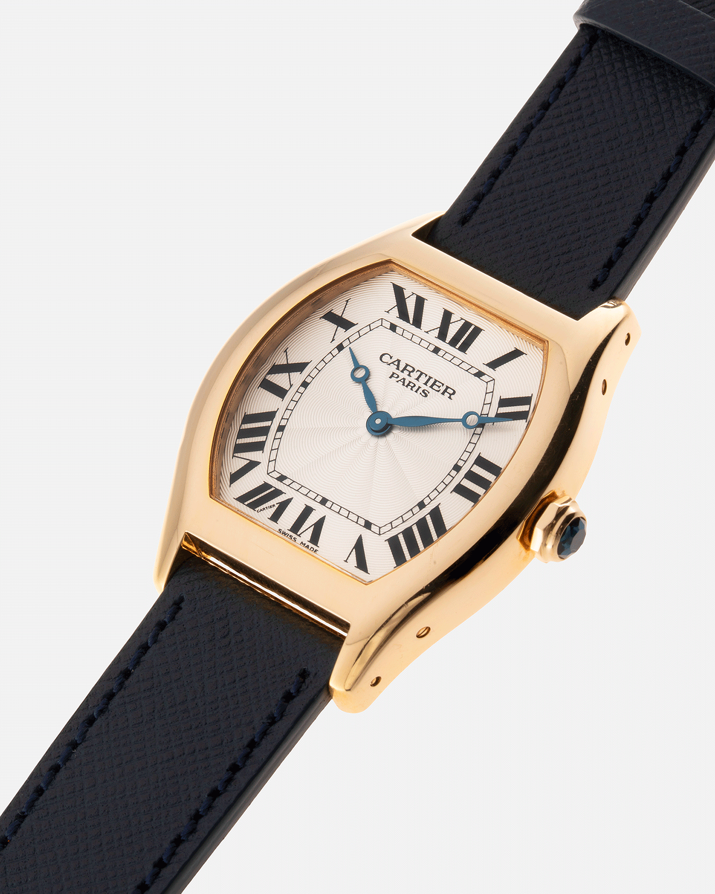 Brand: Cartier Year: 2000’s Model: CPCP Collection Prive Tortue Reference: 2496 Material: 18k Yellow Gold Movement: Cartier Jaeger LeCoultre 9601MC Case Diameter: 43 x 35 mm Strap: Navy Blue Molequin Textured Calf Strap with separate 18k Cartier Yellow Gold Deployant