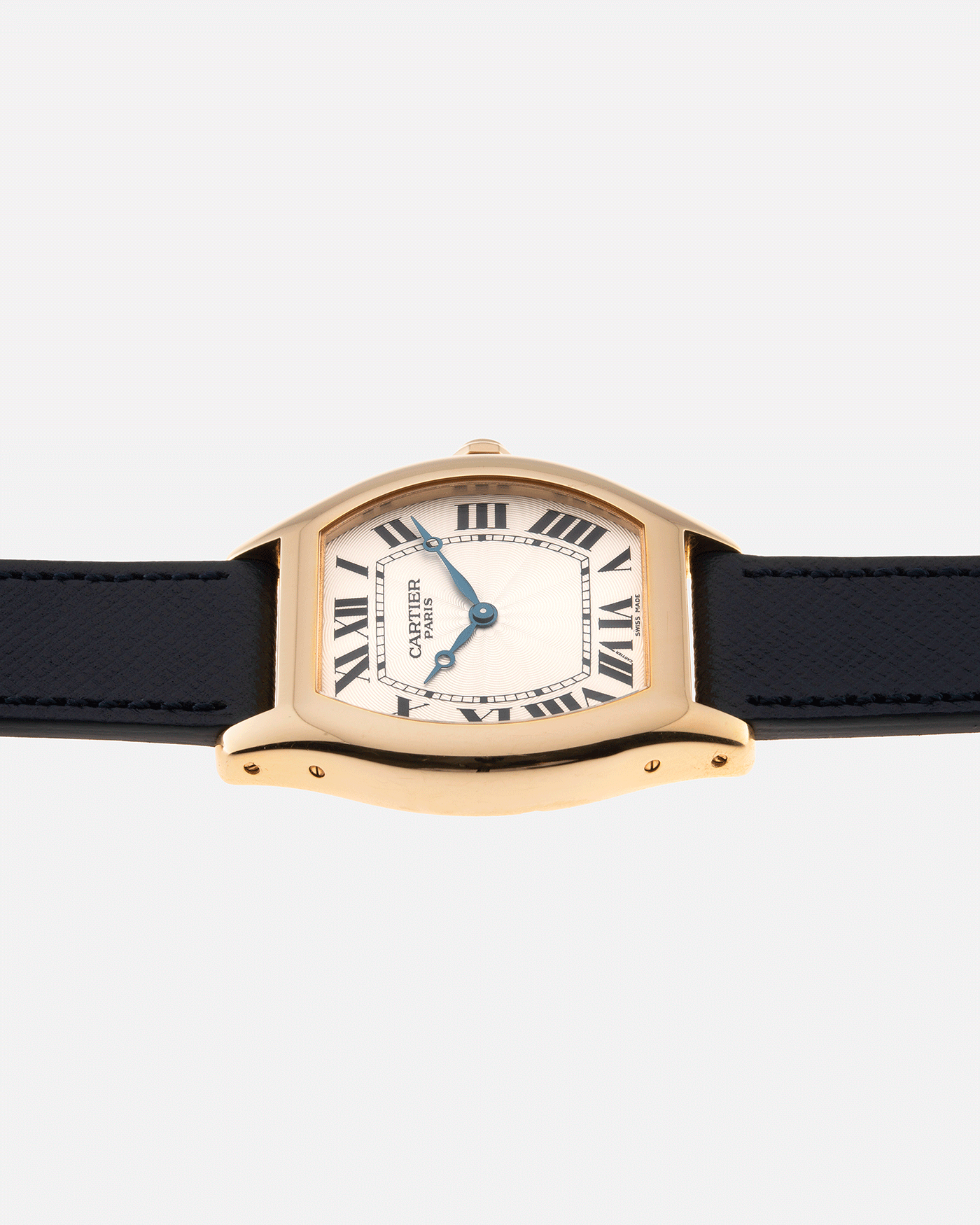 Brand: Cartier Year: 2000’s Model: CPCP Collection Prive Tortue Reference: 2496 Material: 18k Yellow Gold Movement: Cartier Jaeger LeCoultre 9601MC Case Diameter: 43 x 35 mm Strap: Navy Blue Molequin Textured Calf Strap with separate 18k Cartier Yellow Gold Deployant