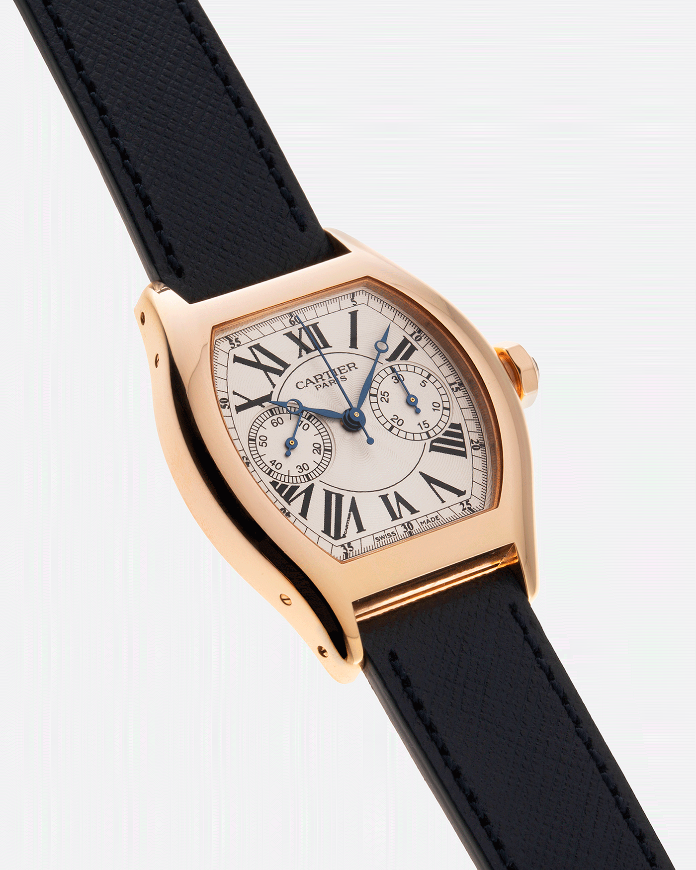 Brand: Cartier Year: 2000’s Model: CPCP Collection Prive Tortue Monopoussoir Reference: 2661 Material: 18k Rose Gold Movement: THA Cal. 045MC Case Diameter: 43 x 35 mm Strap: Navy Blue Molequin Textured Calf Strap with separate 18k Cartier Rose Gold Deployant