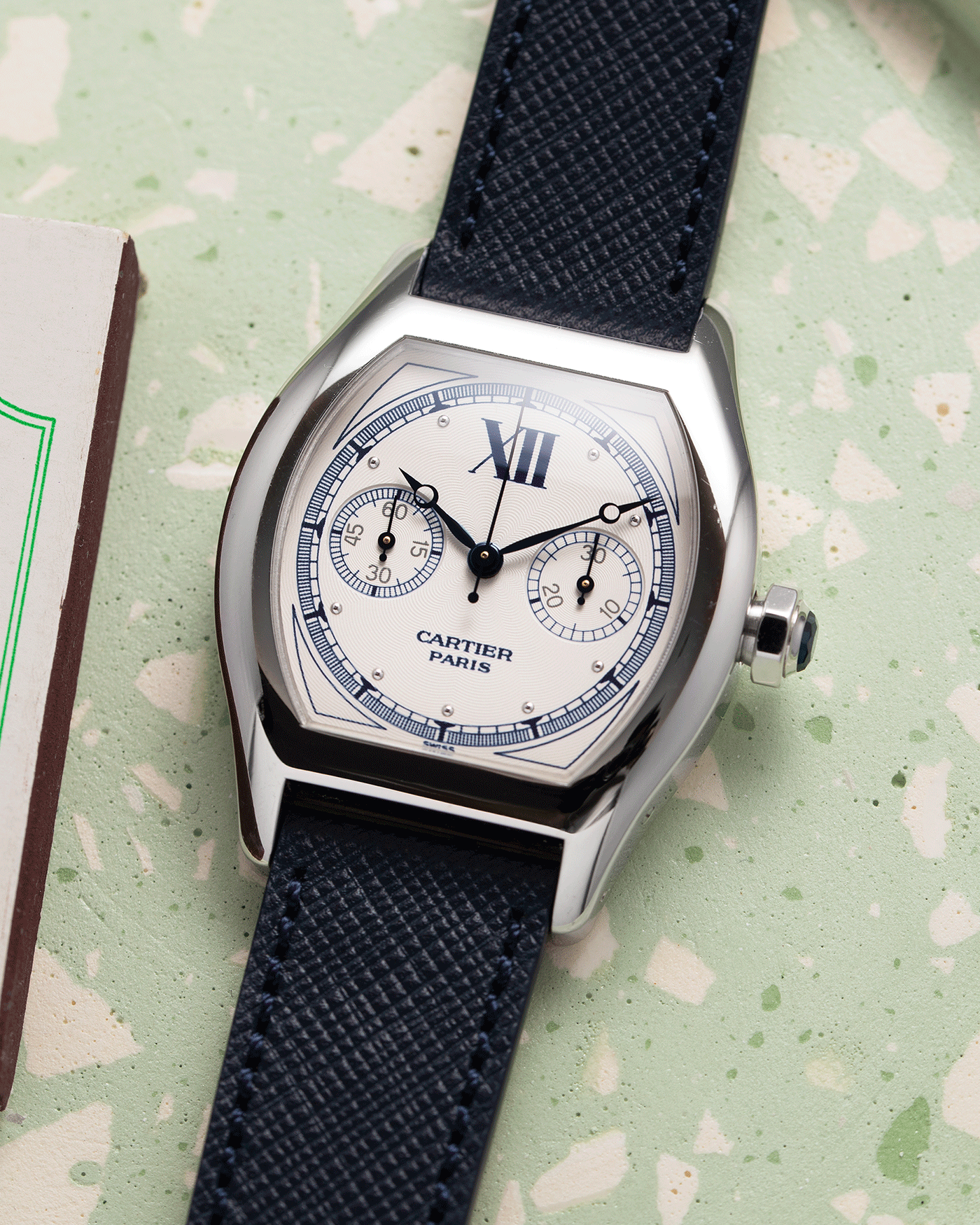 Brand: Cartier Year: 2000’s Model: CPCP Collection Prive Tortue Monopoussoir Reference: 2356 Material: 18k White Gold Movement: THA Cal. 045MC Case Diameter: 43 x 35 mm Strap: Navy Blue Molequin Textured Calf Strap with separate 18k Cartier White Gold Deployant
