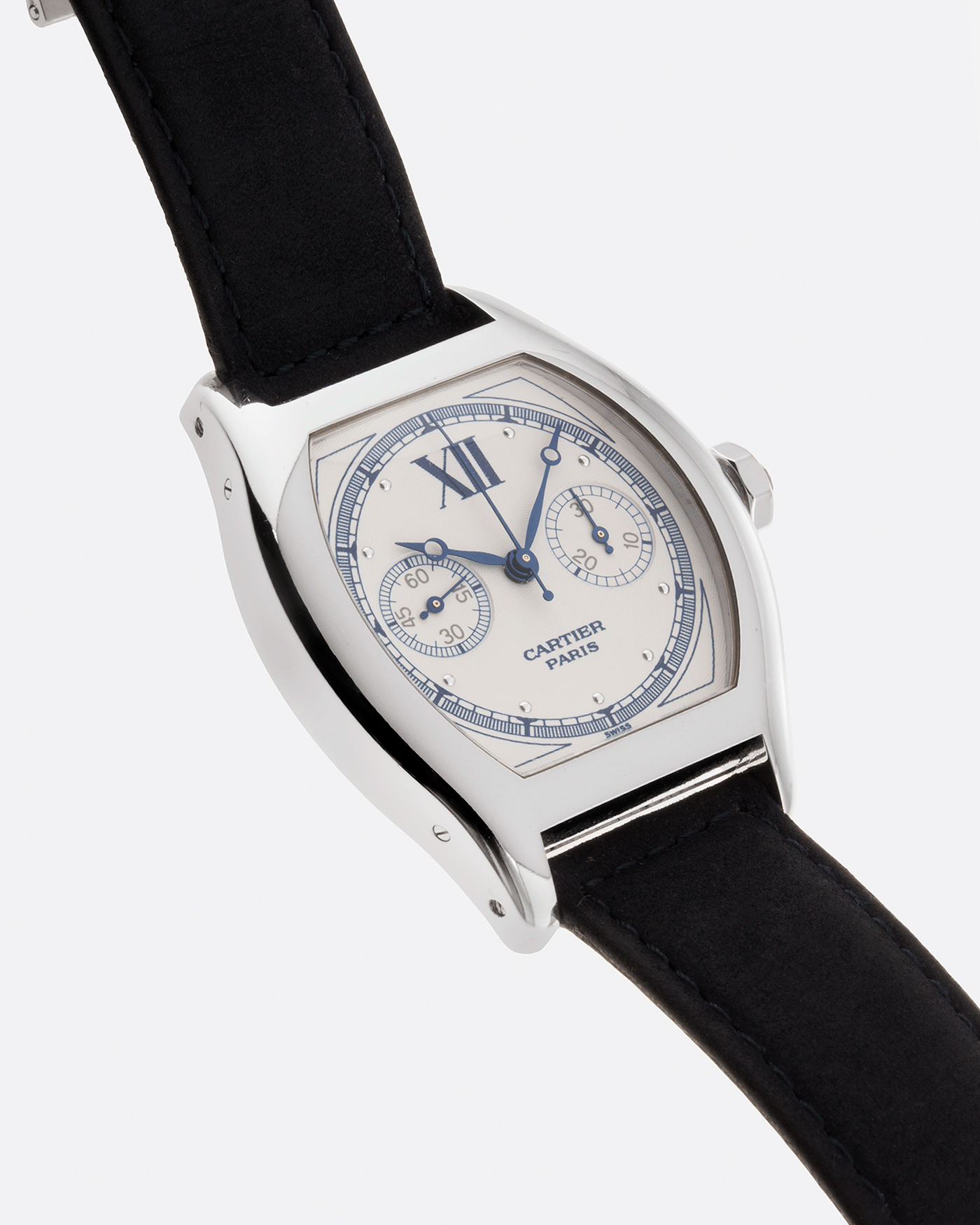Brand: Cartier Year: 2000’s Model: CPCP Collection Prive Tortue Monopoussoir Reference: 2356 Material: 18k White Gold Movement: THA Cal. 045MC Case Diameter: 43 x 35 mm Strap: Navy Blue Suede Calf Strap with separate 18k Cartier White Gold Deployant
