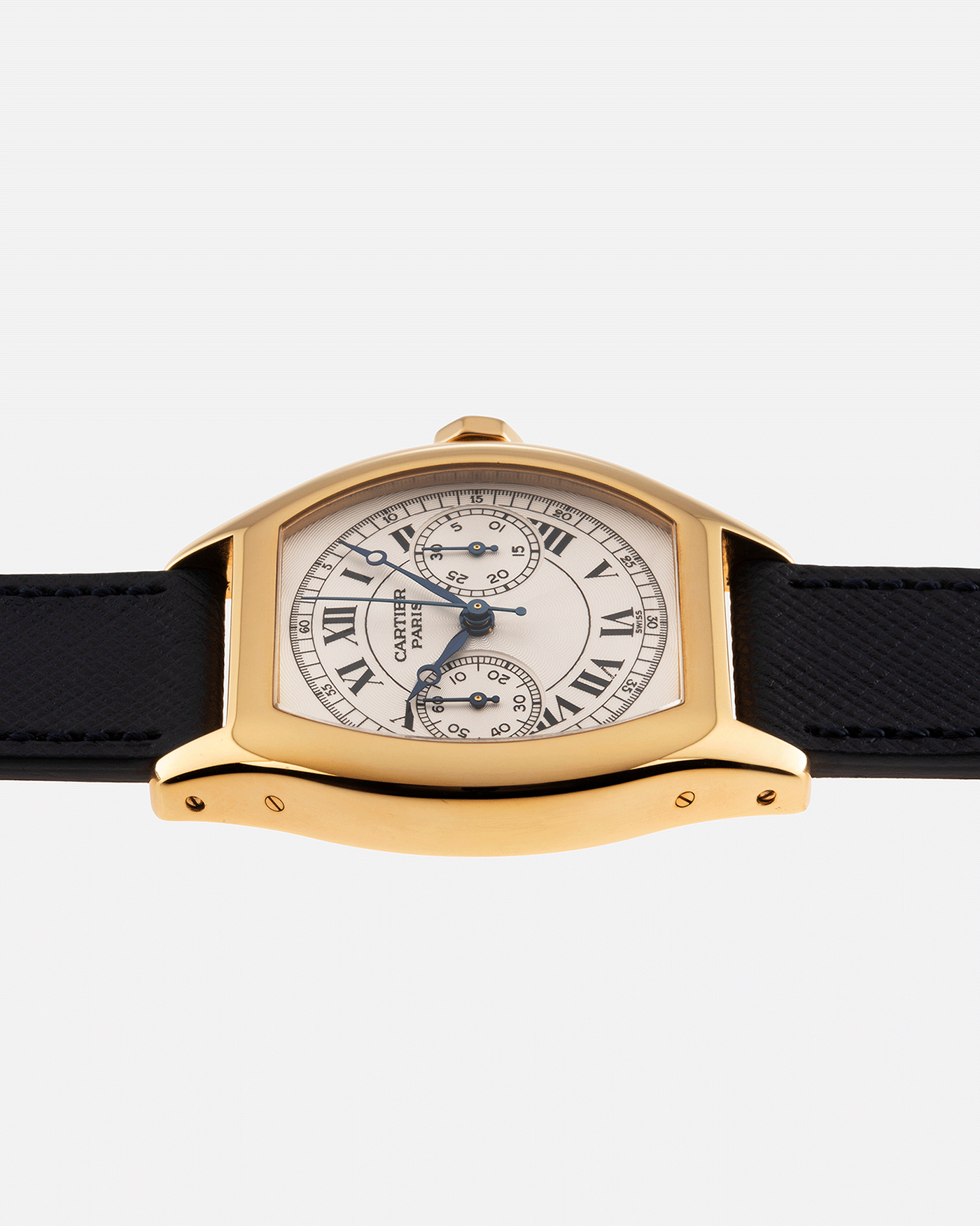Brand: Cartier Year: 2000’s Model: CPCP Collection Prive Tortue Monopoussoir Reference: 2356E Material: 18k Yellow Gold Movement: THA Cal. 045MC Case Diameter: 43 x 35 mm Strap: Molequin Navy Blue Textured Calf with 18k Cartier Yellow Gold Deployant