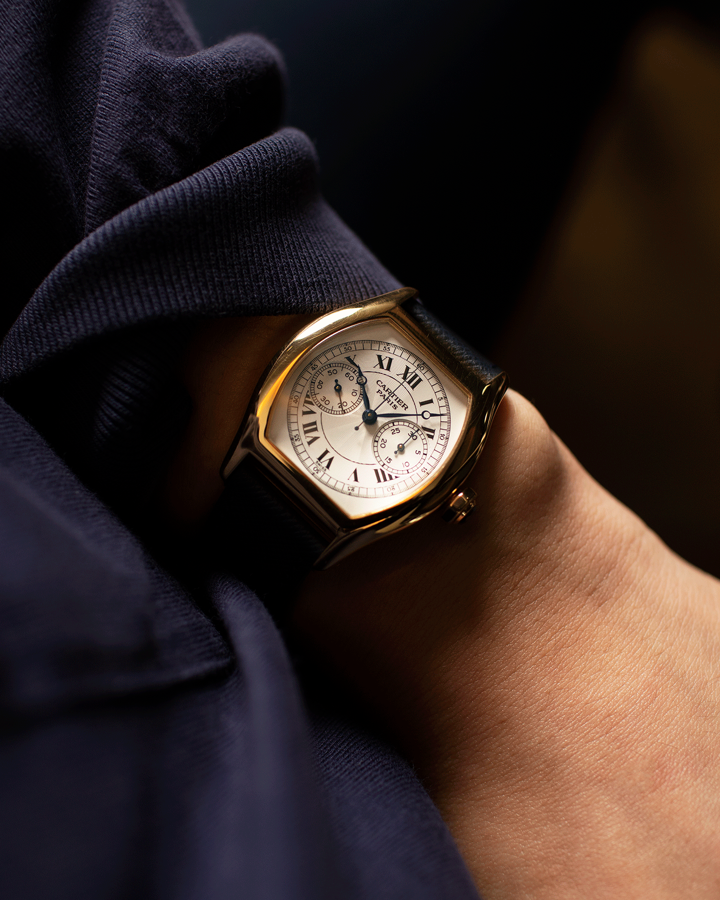 Brand: Cartier Year: 2000’s Model: CPCP Collection Prive Tortue Monopoussoir Reference: 2356E Material: 18k Yellow Gold Movement: THA Cal. 045MC Case Diameter: 43 x 35 mm Strap: Molequin Navy Blue Textured Calf with 18k Cartier Yellow Gold Deployant