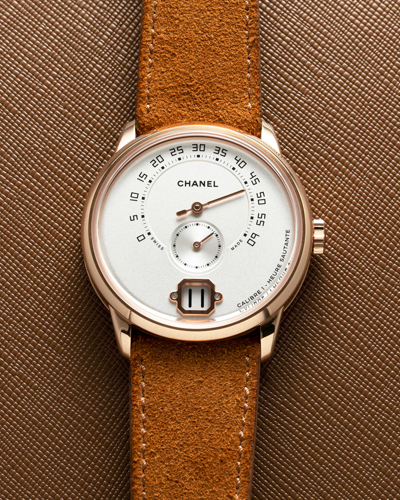 Brand: Chanel Year: 2016 Model: Monsieur De Chanel Jump Hour H6596 Material: 18-carat Beige Gold Movement: In-house Chanel Cal. 1, Manual-Winding  Case Diameter: 40mm Bracelet/Strap: Tanned Suede Strap from Rios 1931 with 18-carat Beige Gold Signed Deployant Clasp