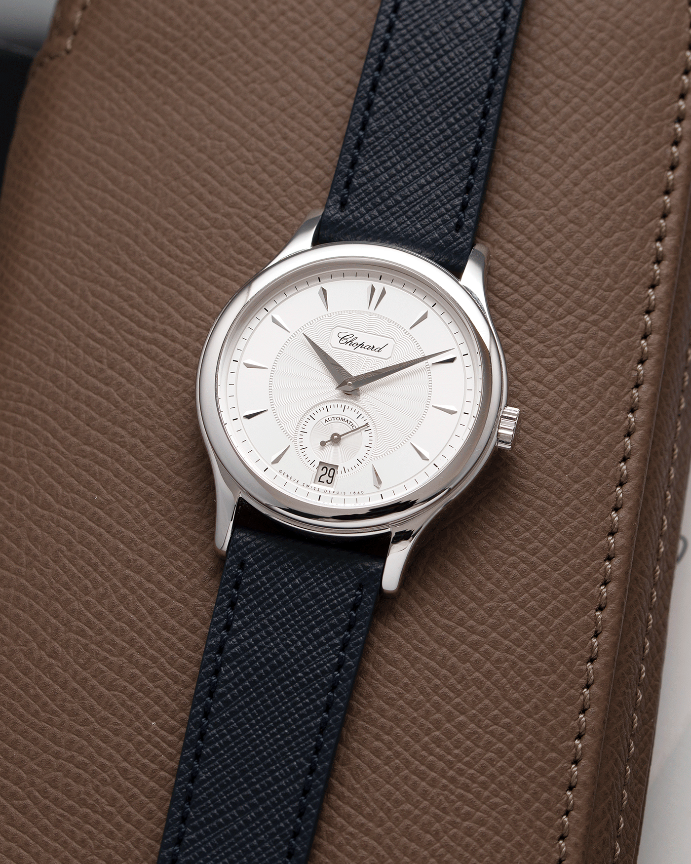 Brand: Chopard L.U.C. Year: 2000’s Model: 16/1860/4 Material: 18k White Gold Movement: In-House Caliber 1.96 Case Diameter: 37mm Strap: Navy Blue Molequin Textured Calf and Brown Chopard Alligator Strap and 18k White Gold Chopard Tang Buckle
