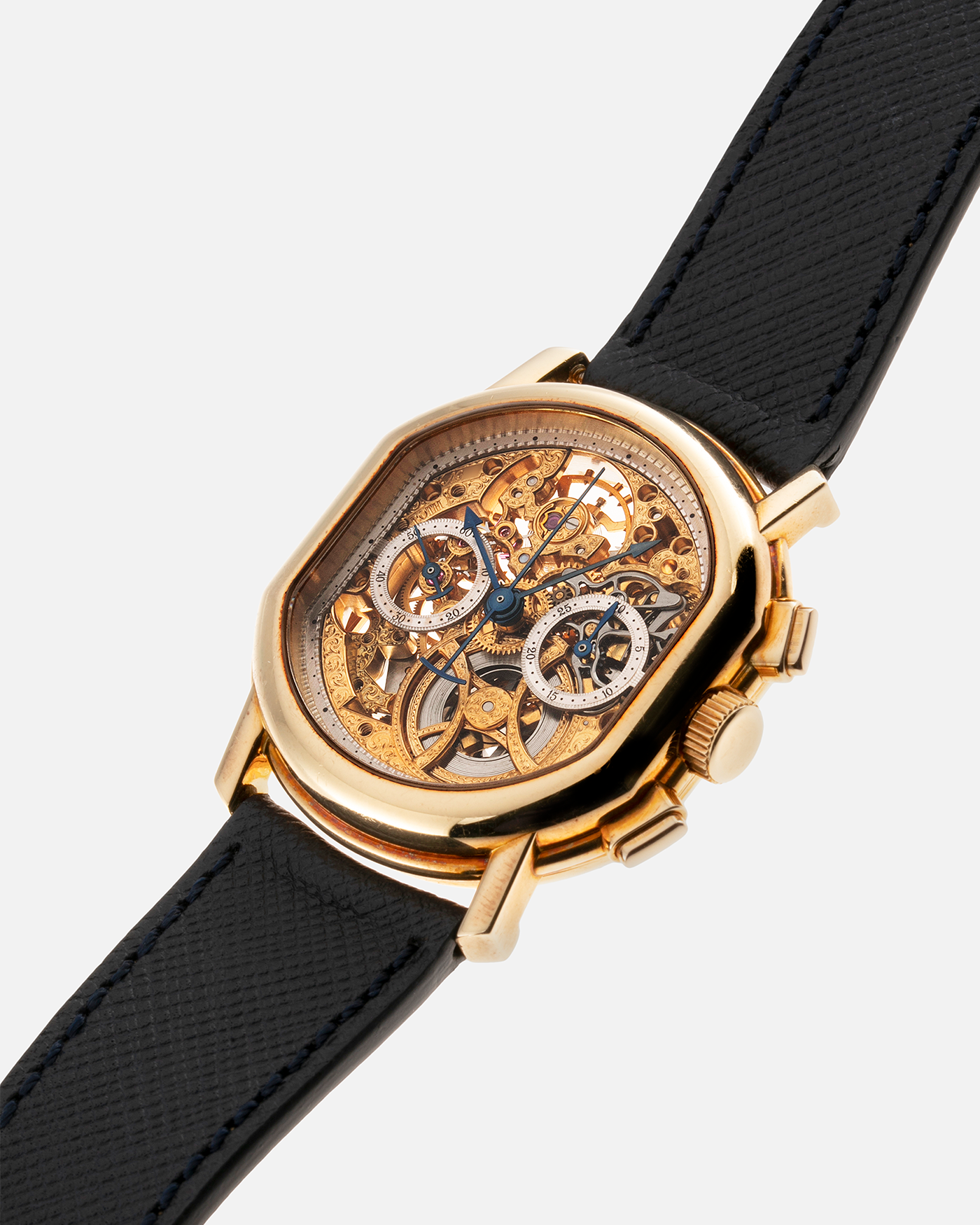 Brand: Daniel Roth Year: 1990’s Model: 2147 Skeleton Material: 18k Yellow Gold Movement: Lemania 2320 Case Diameter: 35mm X 38mm Strap: Molequin Navy Blue Textured Calf Strap and 18k Yellow Gold Daniel Roth Tang Buckle