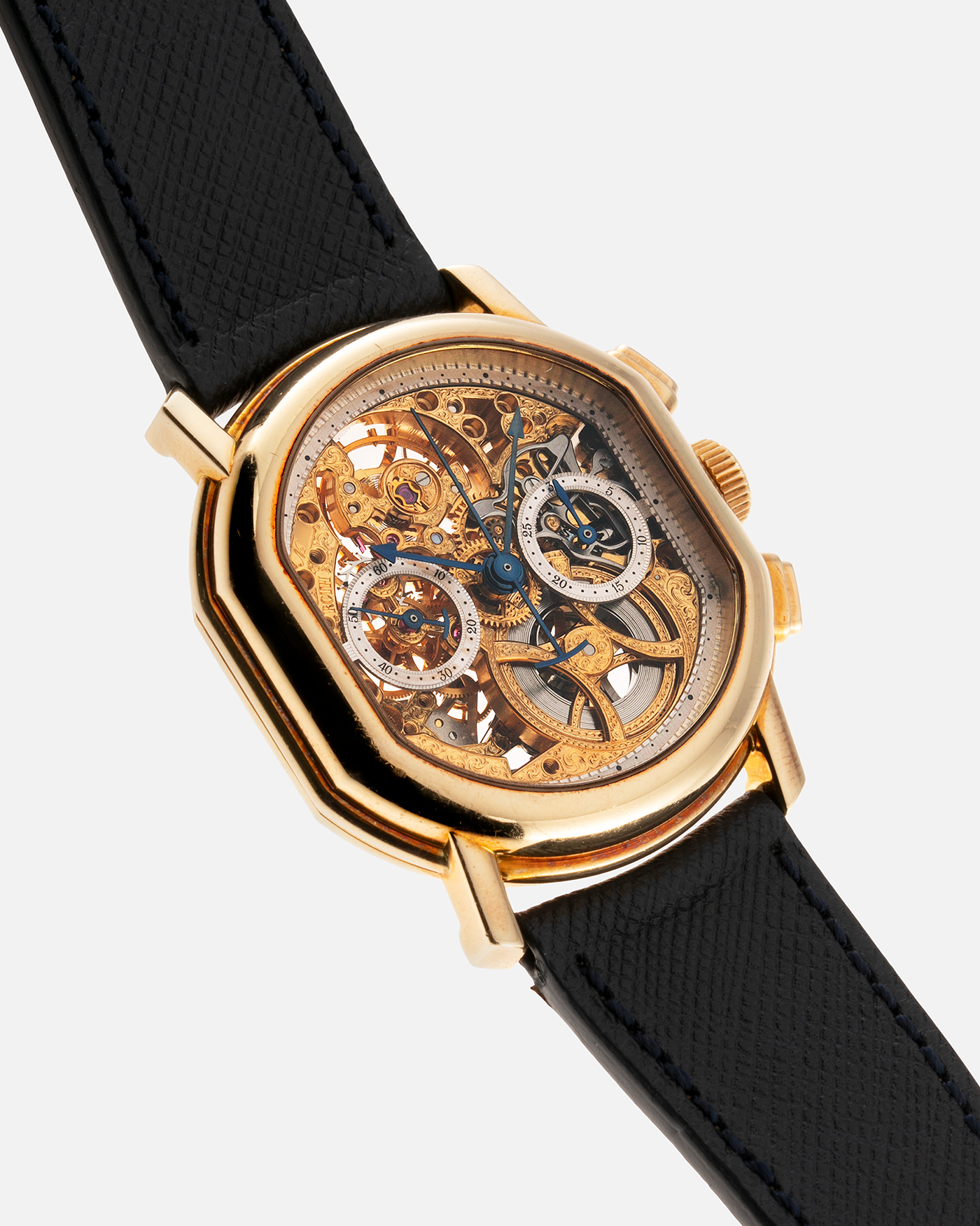 Brand: Daniel Roth Year: 1990’s Model: 2147 Skeleton Material: 18k Yellow Gold Movement: Lemania 2320 Case Diameter: 35mm X 38mm Strap: Molequin Navy Blue Textured Calf Strap and 18k Yellow Gold Daniel Roth Tang Buckle