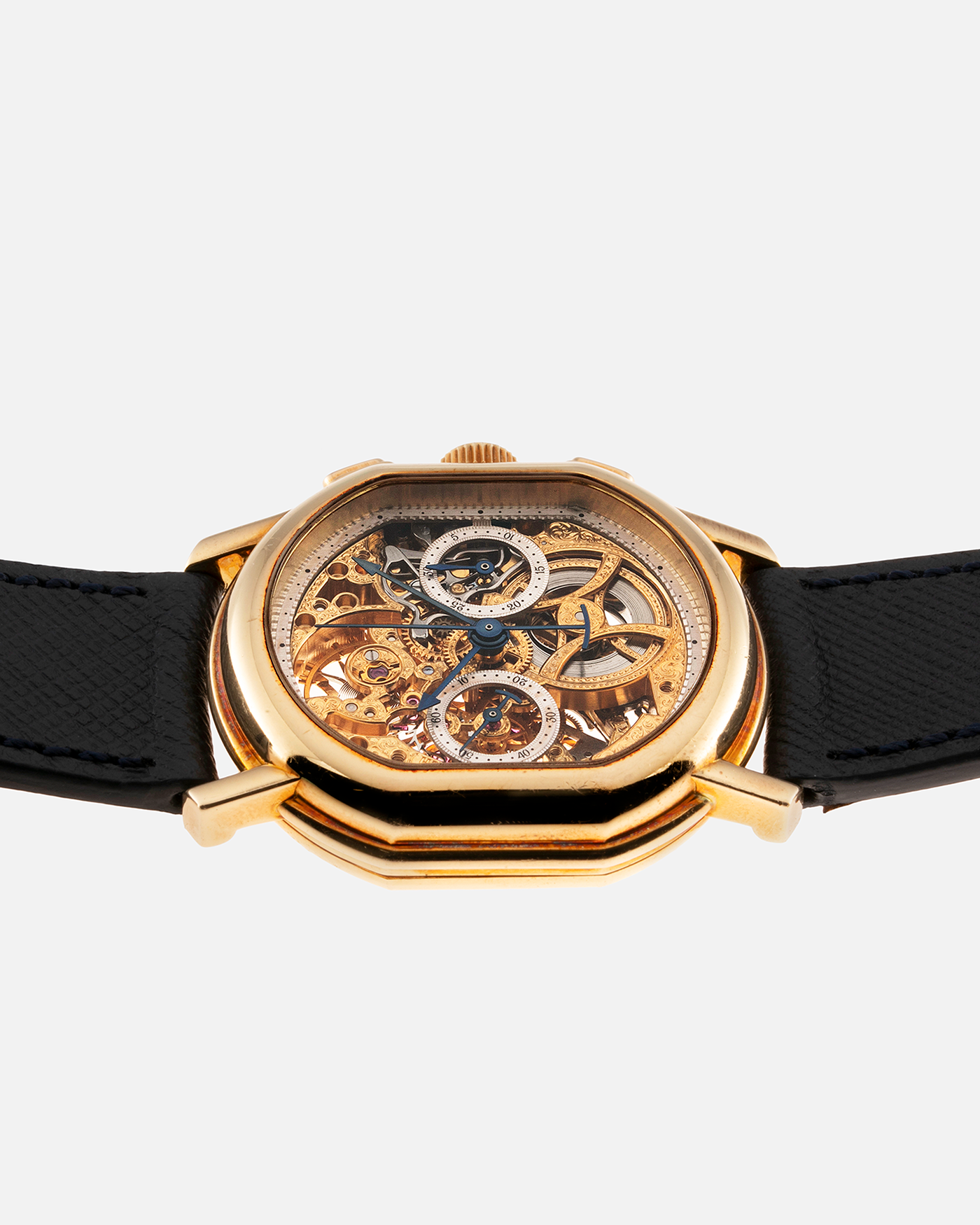 Brand: Daniel Roth Year: 1990’s Model: 2147 Skeleton Material: 18k Yellow Gold Movement: Lemania 2320 Case Diameter: 35mm X 38mm Strap: Molequin Navy Blue Textured Calf Strap and 18k Yellow Gold Daniel Roth Tang Buckle