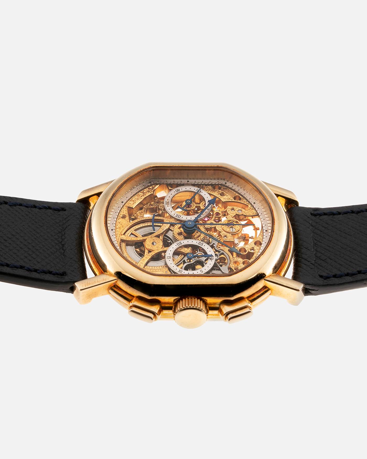 Brand: Daniel Roth Year: 1990’s Model: 2147 Skeleton Material: 18k Yellow Gold Movement: Lemania 2320 Case Diameter: 35mm X 38mm Strap: Molequin Navy Blue Textured Calf Strap and 18k Yellow Gold Daniel Roth Tang Buckle