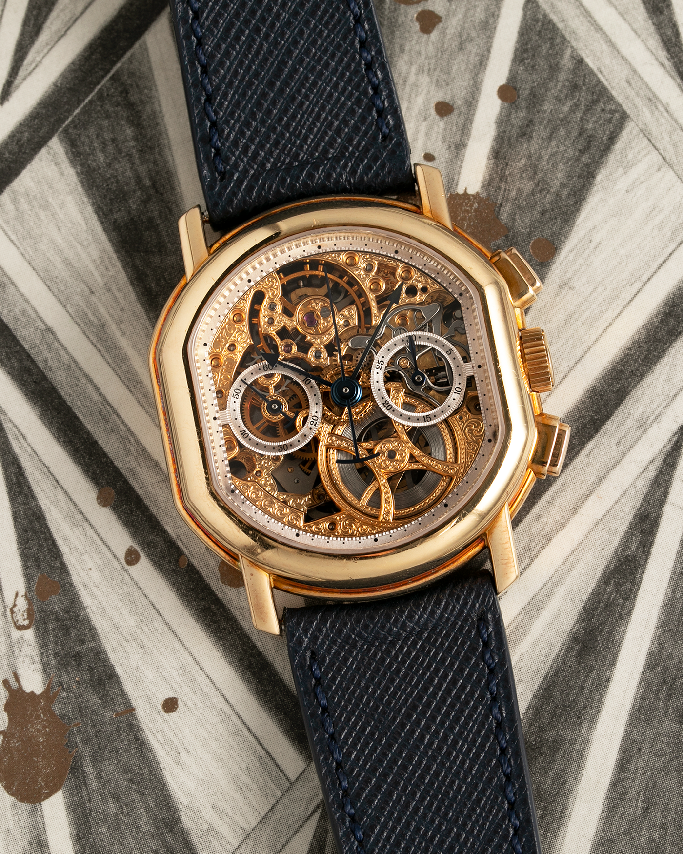 Brand: Daniel Roth Year: 1990’s Model: 2147 Skeleton Material: 18k Yellow Gold Movement: Lemania 2320 Case Diameter: 35mm X 38mm Strap: Molequin Navy Blue Textured Calf Strap and 18k Yellow Gold Daniel Roth Tang Buckle