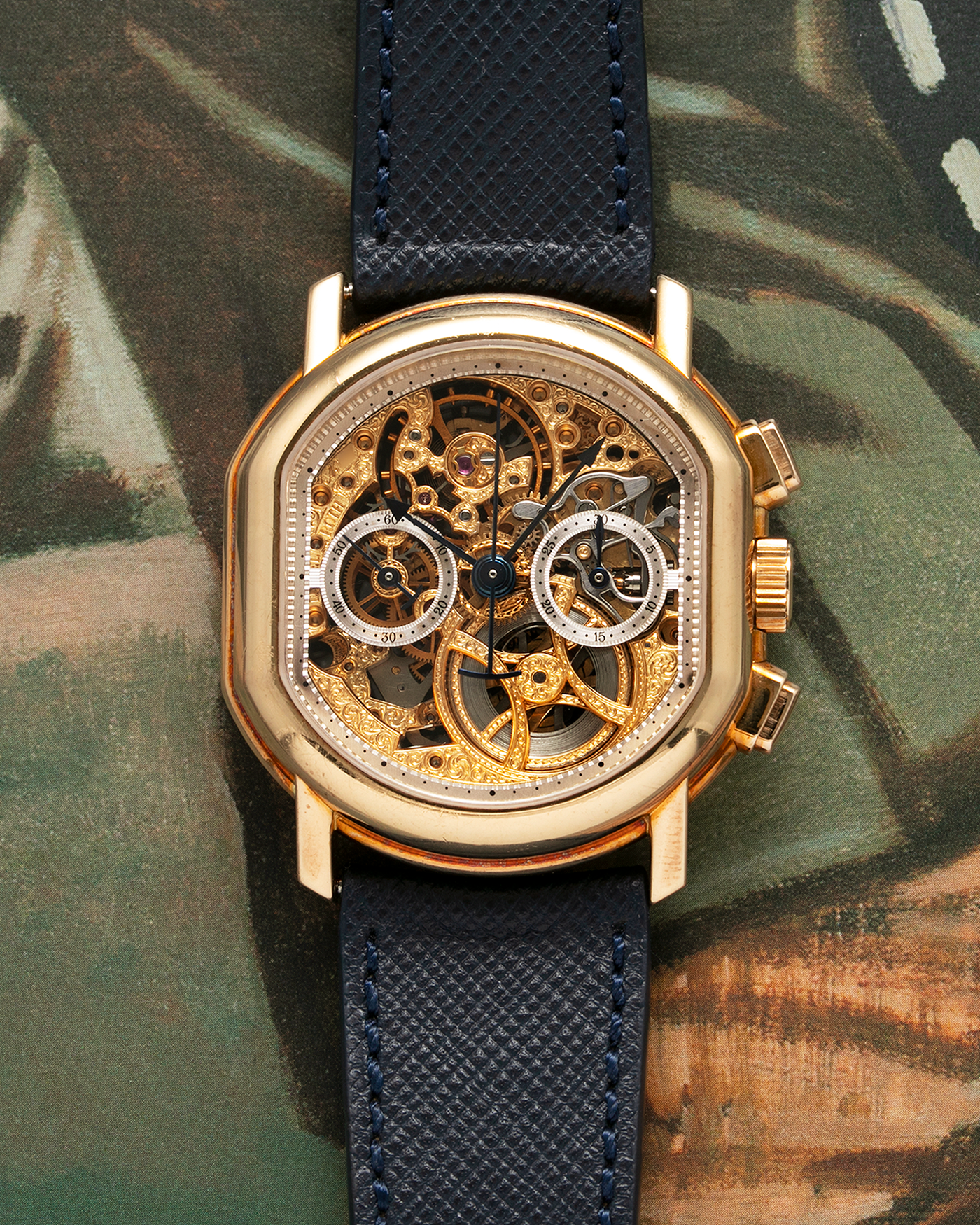 Brand: Daniel Roth Year: 1990’s Model: 2147 Skeleton Material: 18k Yellow Gold Movement: Lemania 2320 Case Diameter: 35mm X 38mm Strap: Molequin Navy Blue Textured Calf Strap and 18k Yellow Gold Daniel Roth Tang Buckle