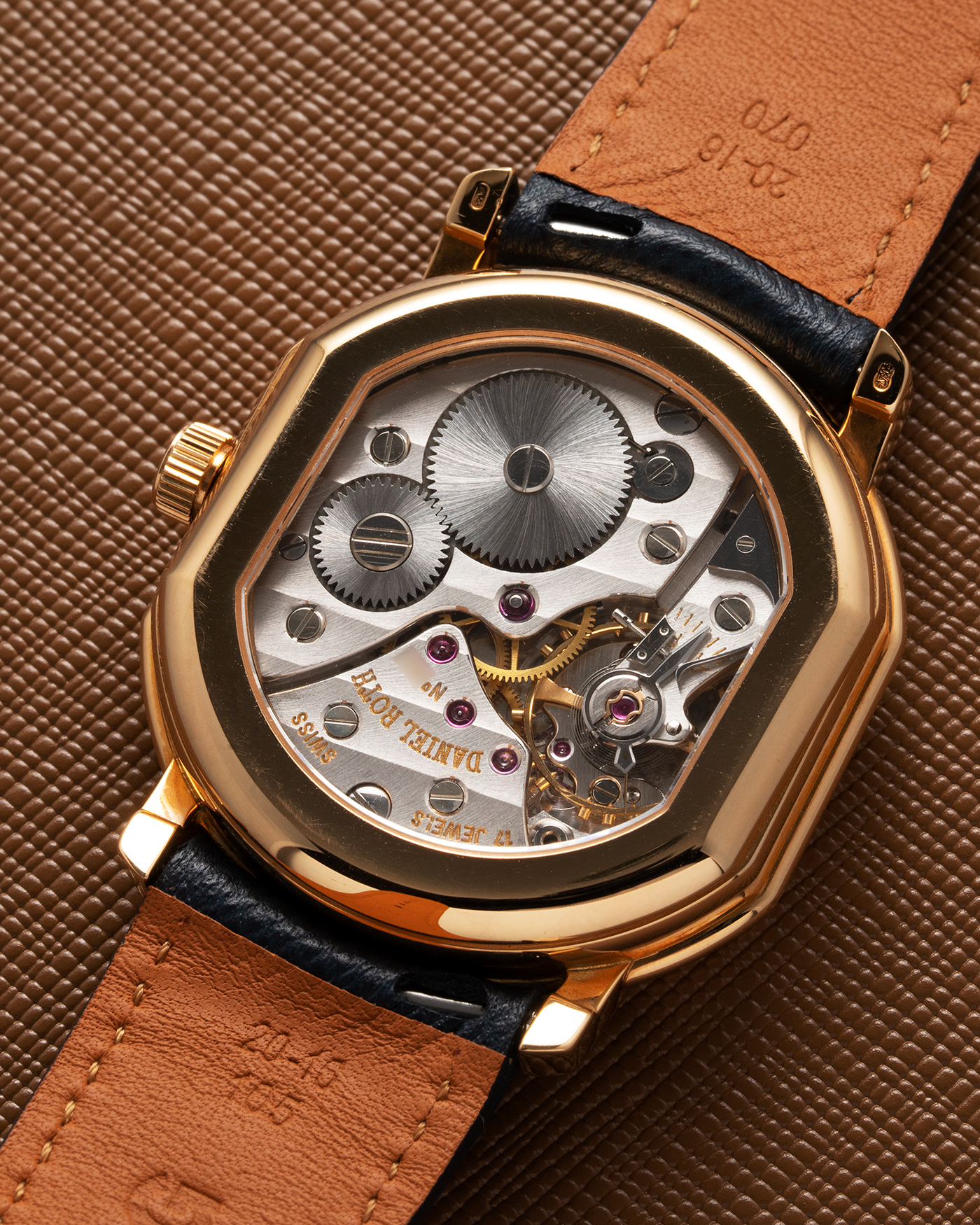 Brand: Daniel Roth Year: 1990’s Model: C127 Material: 18k Yellow Gold Movement: Lemania 27LN with Retrograde Function Case Diameter: 35mm X 38mm Strap: Molequin Navy Blue Textured Calf Strap and 18k Yellow Gold Daniel Roth Tang Buckle