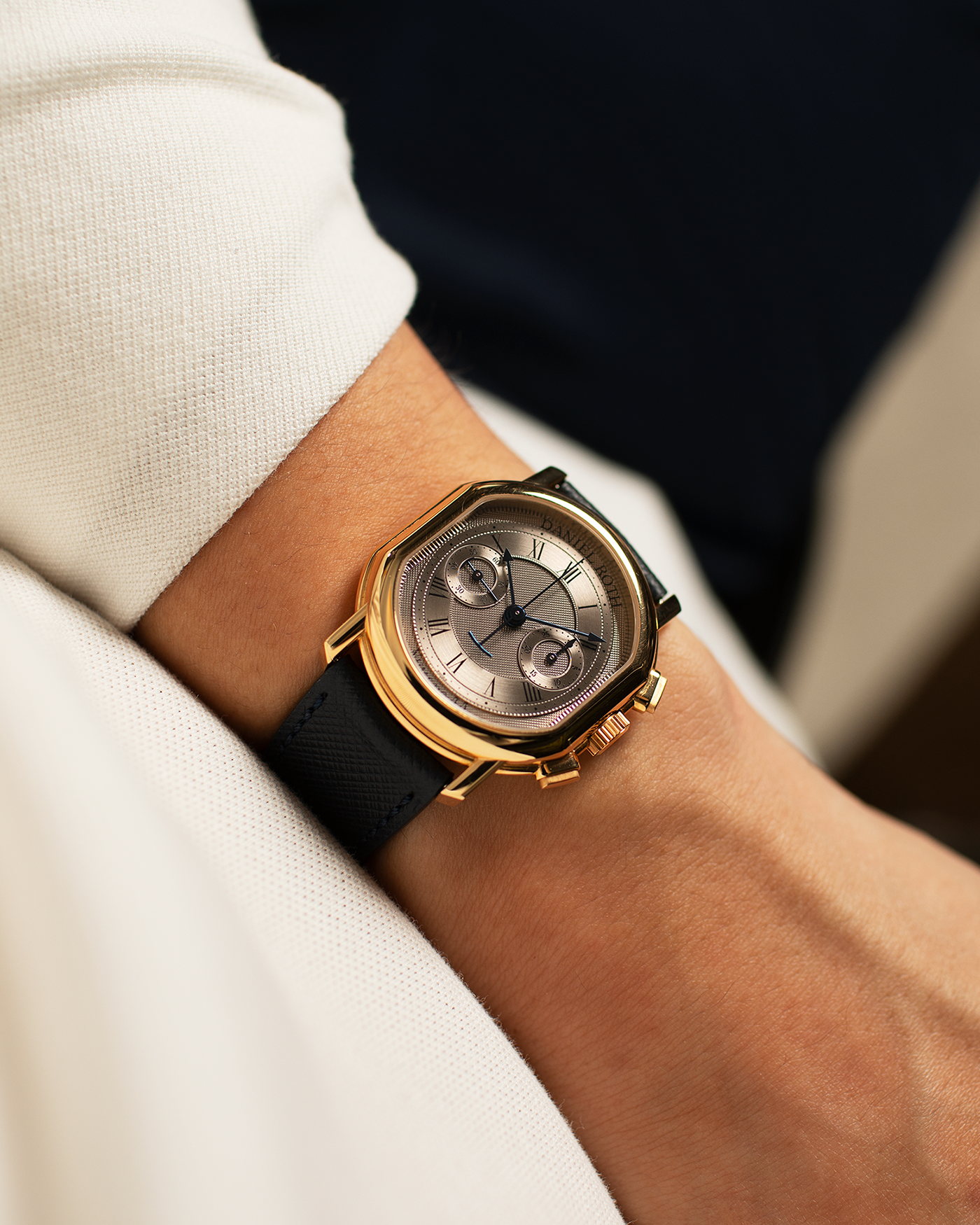 Brand: Daniel Roth Year: 1990’s Model: C147 Material: 18k Yellow Gold Movement: Lemania 2320 Case Diameter: 35mm X 38mm Strap: Molequin Navy Blue Textured Calf Strap and 18k Yellow Gold Daniel Roth Tang Buckle