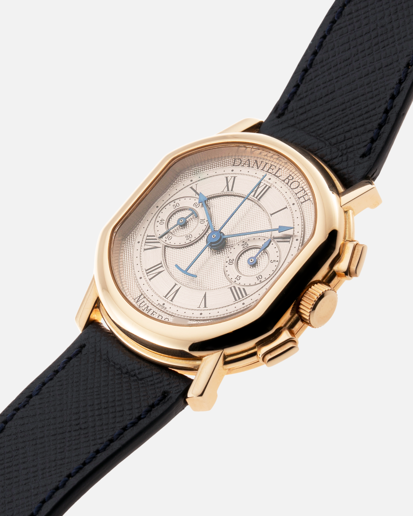 Brand: Daniel Roth Year: 1990’s Model: C147 Material: 18k Yellow Gold Movement: Lemania 2320 Case Diameter: 35mm X 38mm Strap: Molequin Navy Blue Textured Calf Strap and 18k Yellow Gold Daniel Roth Tang Buckle