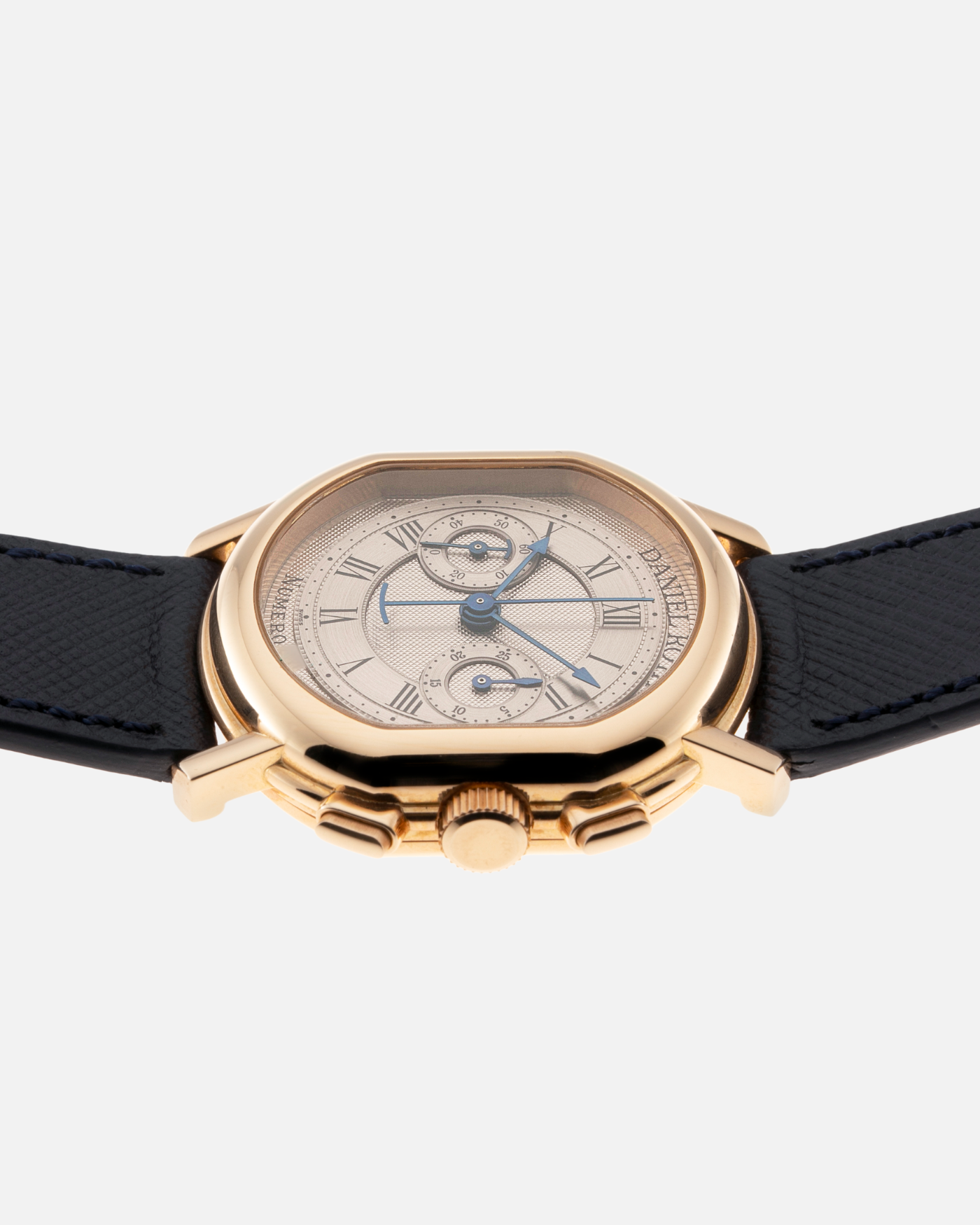 Brand: Daniel Roth Year: 1990’s Model: C147 Material: 18k Yellow Gold Movement: Lemania 2320 Case Diameter: 35mm X 38mm Strap: Molequin Navy Blue Textured Calf Strap and 18k Yellow Gold Daniel Roth Tang Buckle
