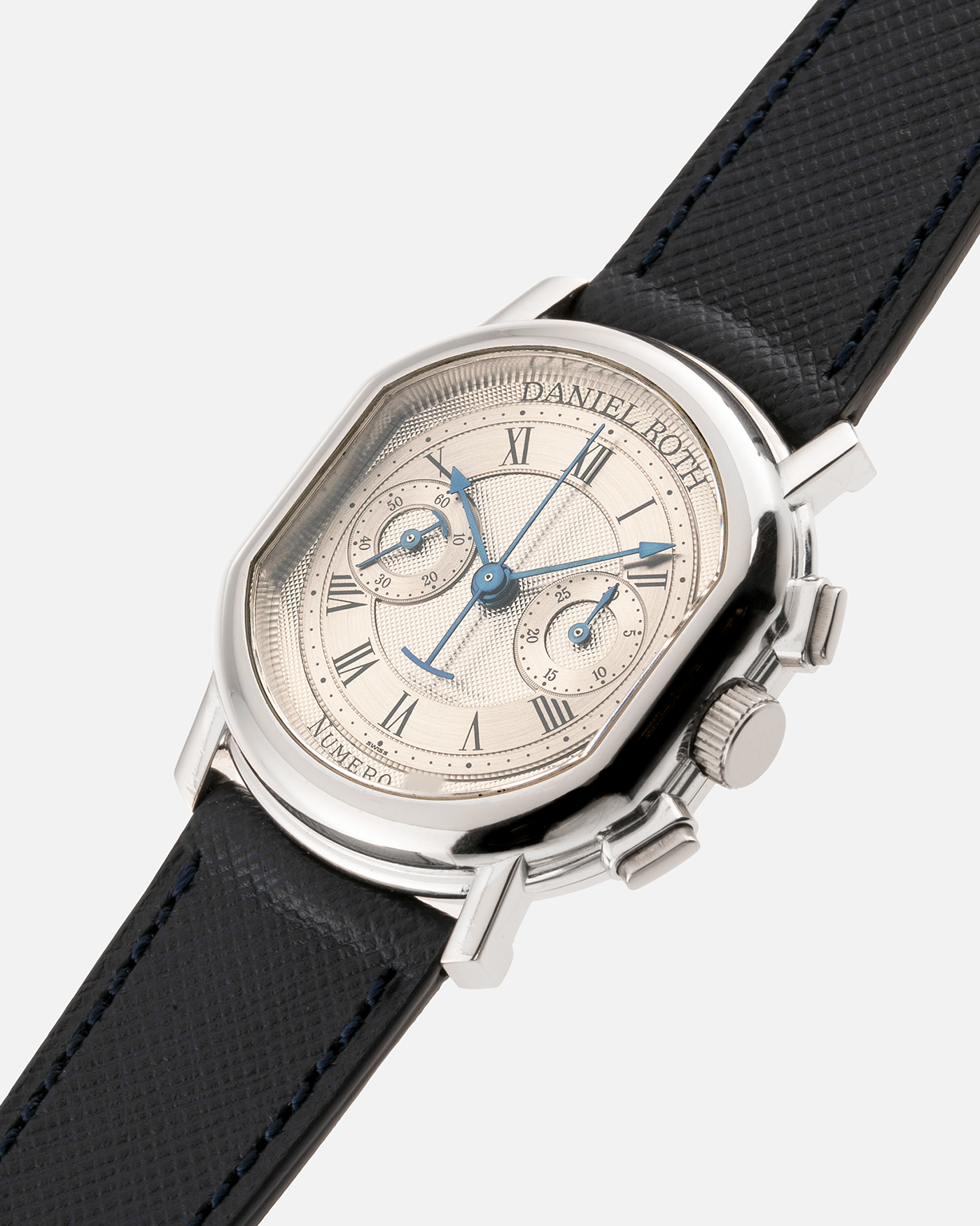 Brand: Daniel Roth Year: 1990’s Model: 2147 Material: 18k White Gold Movement: Lemania 2320 Case Diameter: 35mm X 38mm Strap: Molequin Navy Blue Textured Calf Strap and 18k White Gold Daniel Roth Tang Buckle