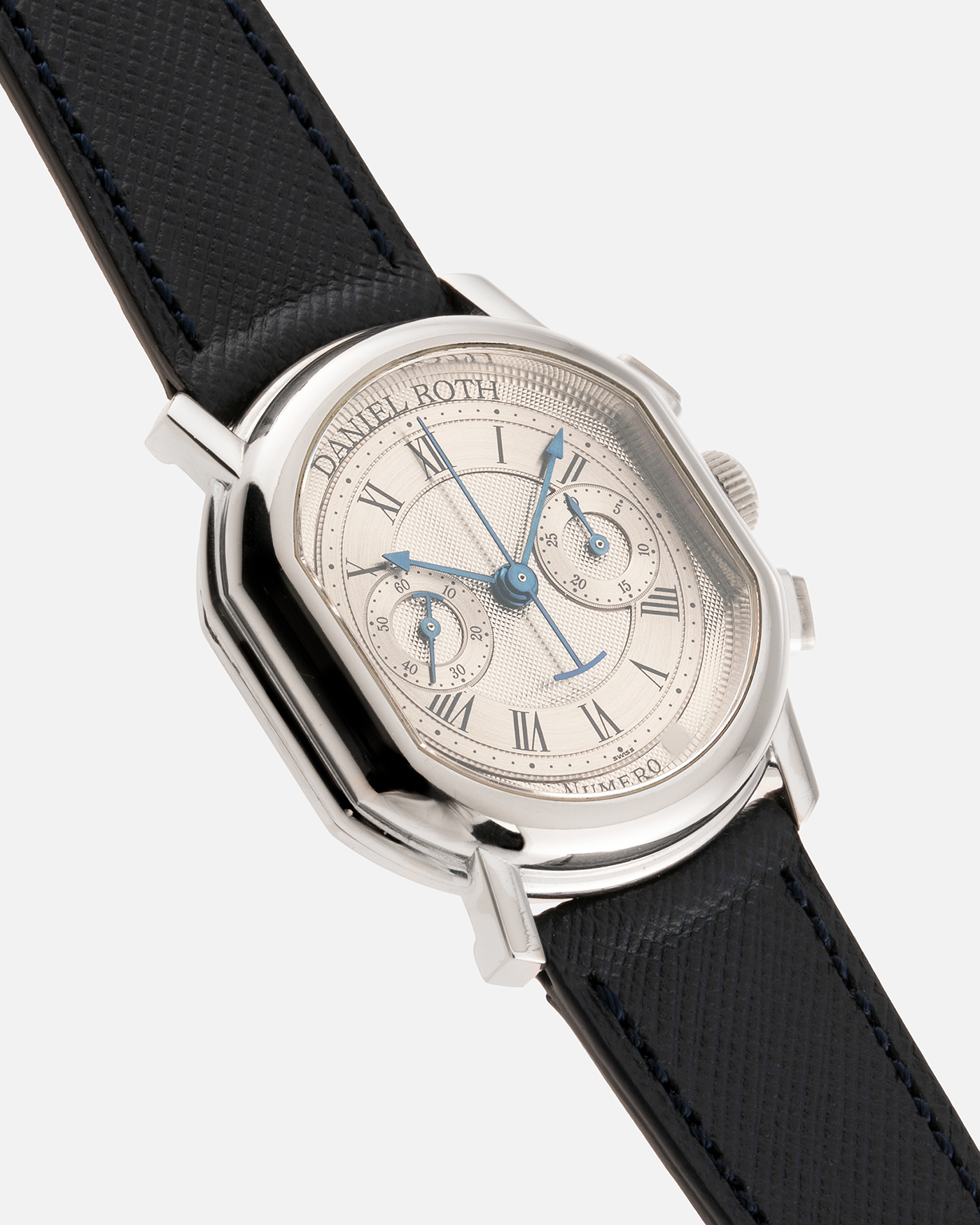 Brand: Daniel Roth Year: 1990’s Model: 2147 Material: 18k White Gold Movement: Lemania 2320 Case Diameter: 35mm X 38mm Strap: Molequin Navy Blue Textured Calf Strap and 18k White Gold Daniel Roth Tang Buckle