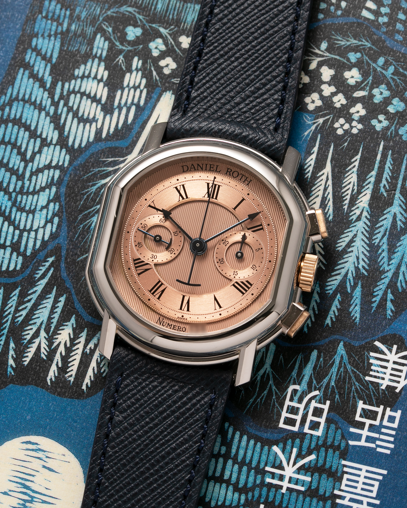 Brand: Daniel Roth Year: 1990’s Model: 2147 Material: 18k White Gold and 18k Yellow Gold Movement: Lemania 2320 Case Diameter: 35mm X 38mm Strap: Molequin Navy Blue Textured Calf Strap and 18k White Gold Daniel Roth Tang Buckle
