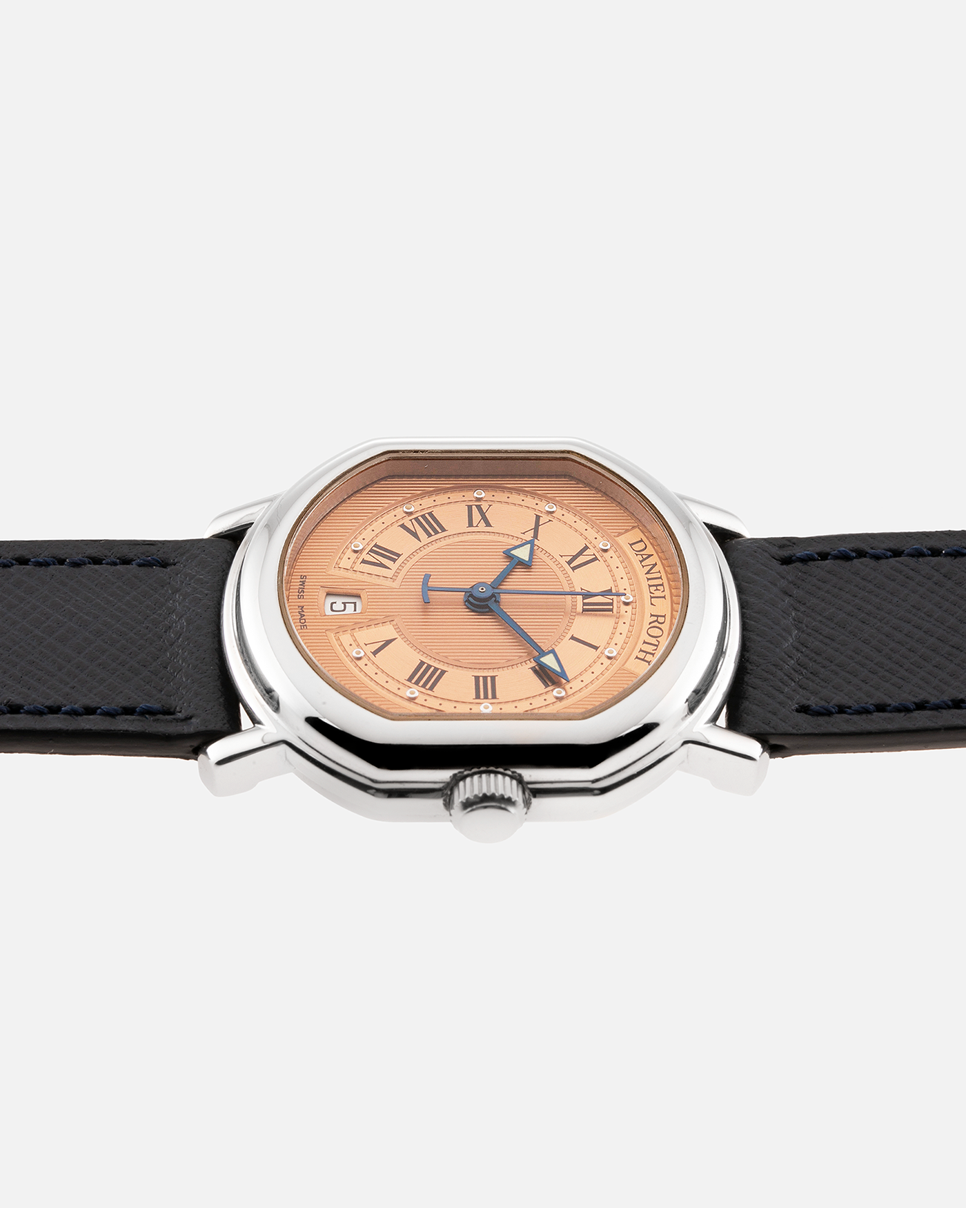 Brand: Daniel Roth Year: 1990’s Model: Le Sentier Material: Stainless Steel Movement: Frederic Piguet Cal. 9.51 Case Diameter: 36mm X 31mm Strap: Molequin Navy Blue Textured Calf Strap and Stainless Steel Daniel Roth Tang Buckle