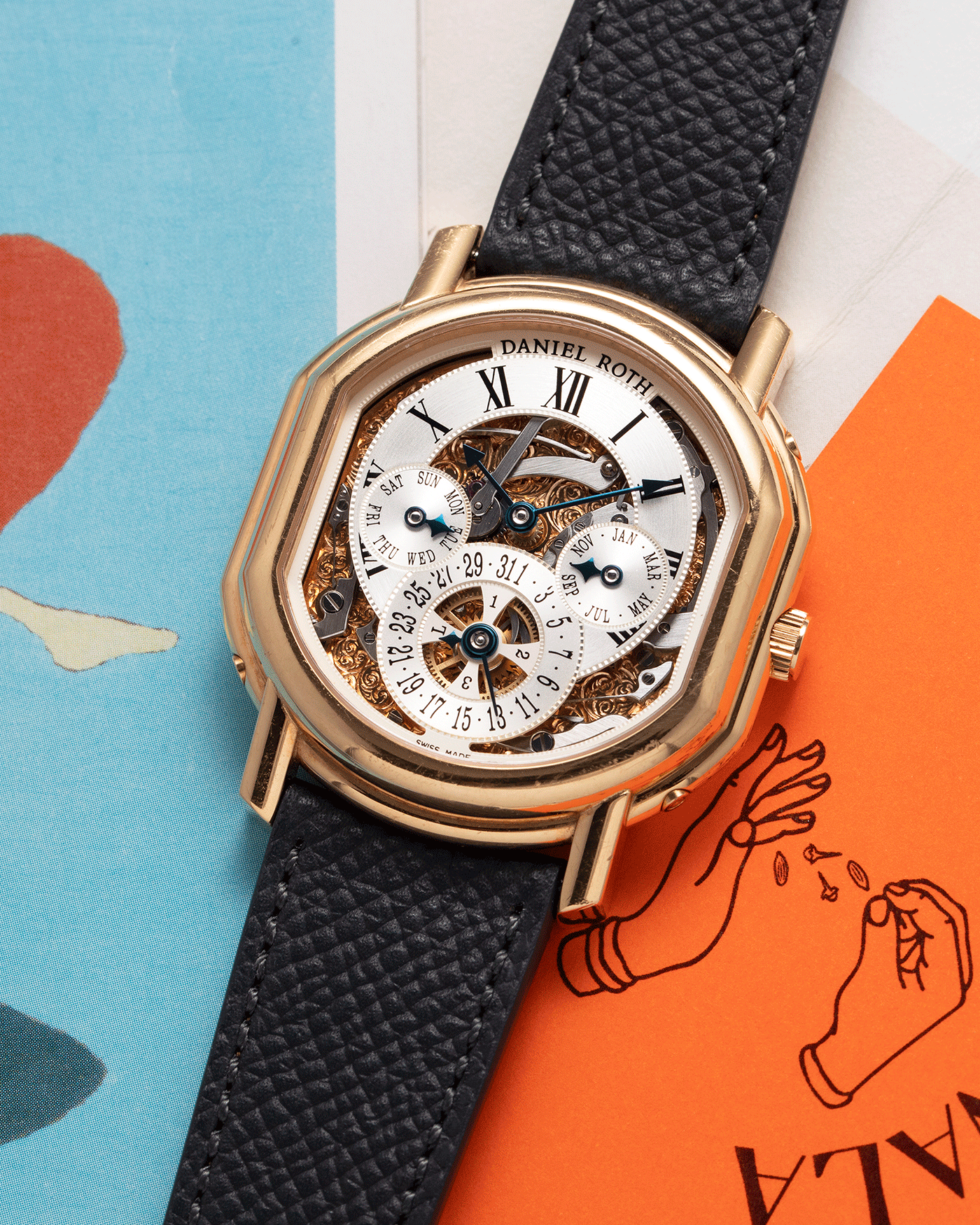 Brand: Daniel Roth Year: 1990’s Model: 119X40 Perpetual Calendar Skeleton Movement: Heavily Modified Lemania 8810 Material: 18k Yellow Gold Case Diameter: 38mmX41mm Bracelet/Strap: Molequin Anthracite Grained Calf with 18k Yellow Gold Tang Buckle