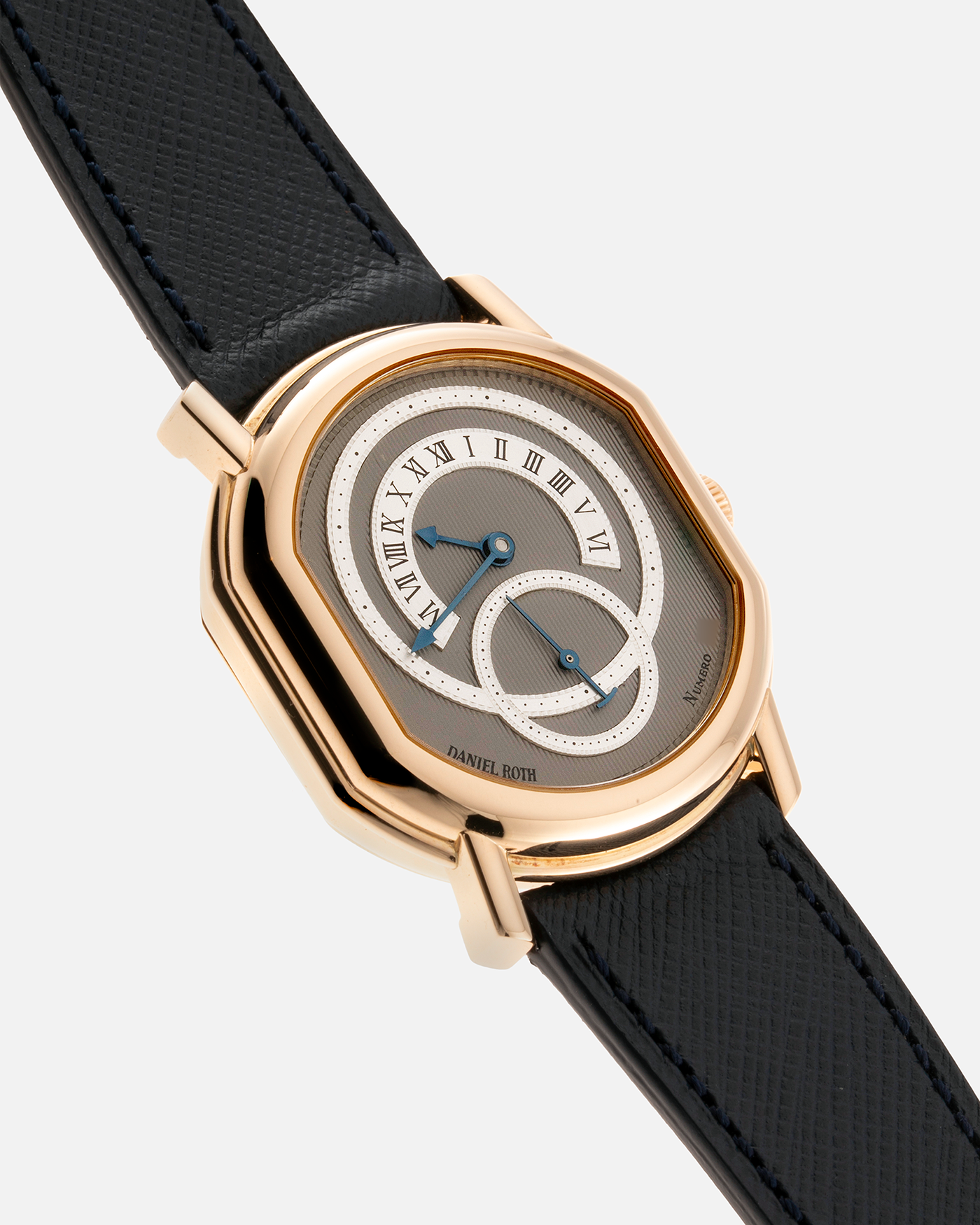 Brand: Daniel Roth Year: 1990’s Model: C127 Material: 18k Yellow Gold Movement: Lemania 27LN with Retrograde Function Case Diameter: 35mm X 38mm Strap: Molequin Navy Blue Textured Calf Strap and 18k Yellow Gold Daniel Roth Tang Buckle