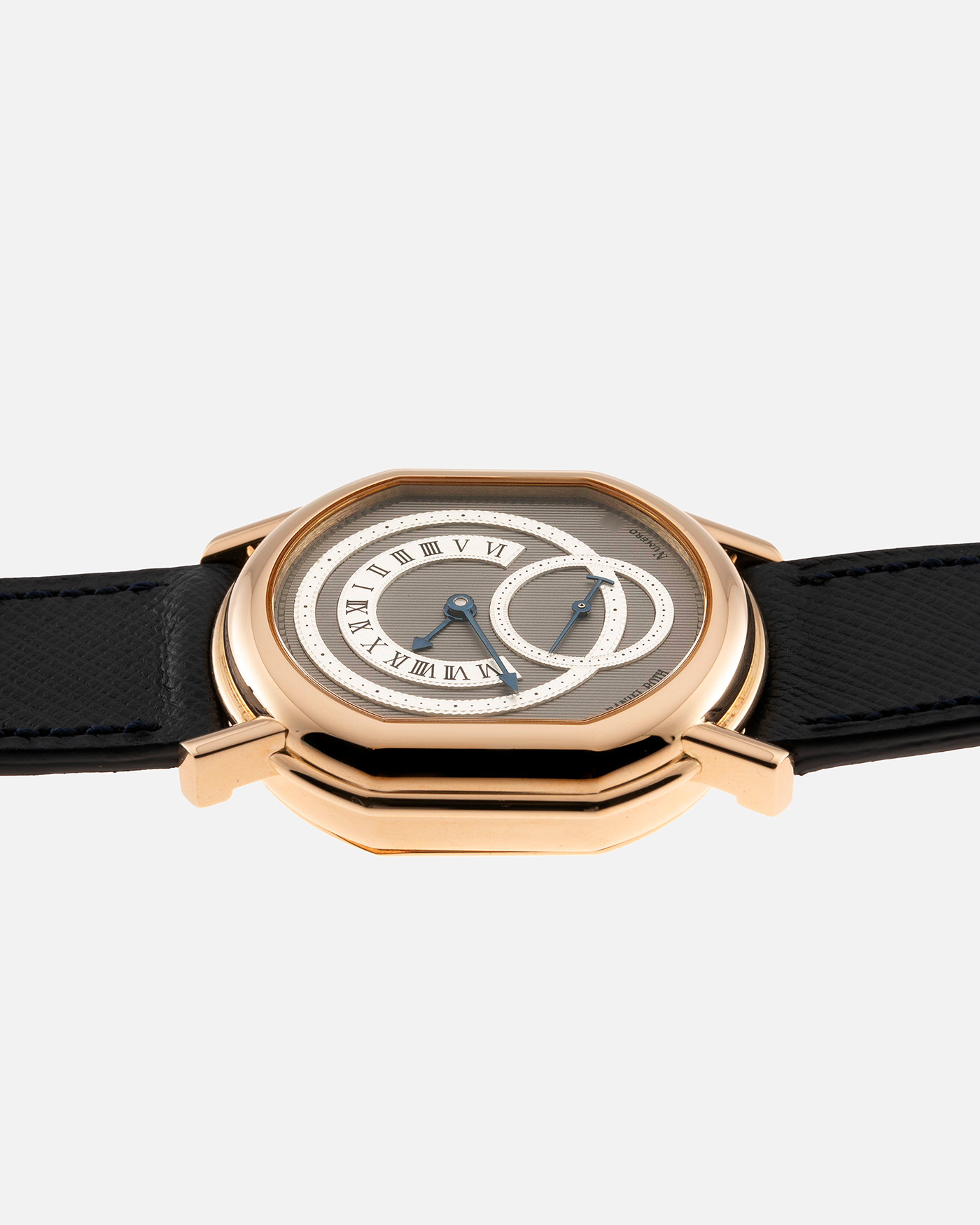 Brand: Daniel Roth Year: 1990’s Model: C127 Material: 18k Yellow Gold Movement: Lemania 27LN with Retrograde Function Case Diameter: 35mm X 38mm Strap: Molequin Navy Blue Textured Calf Strap and 18k Yellow Gold Daniel Roth Tang Buckle