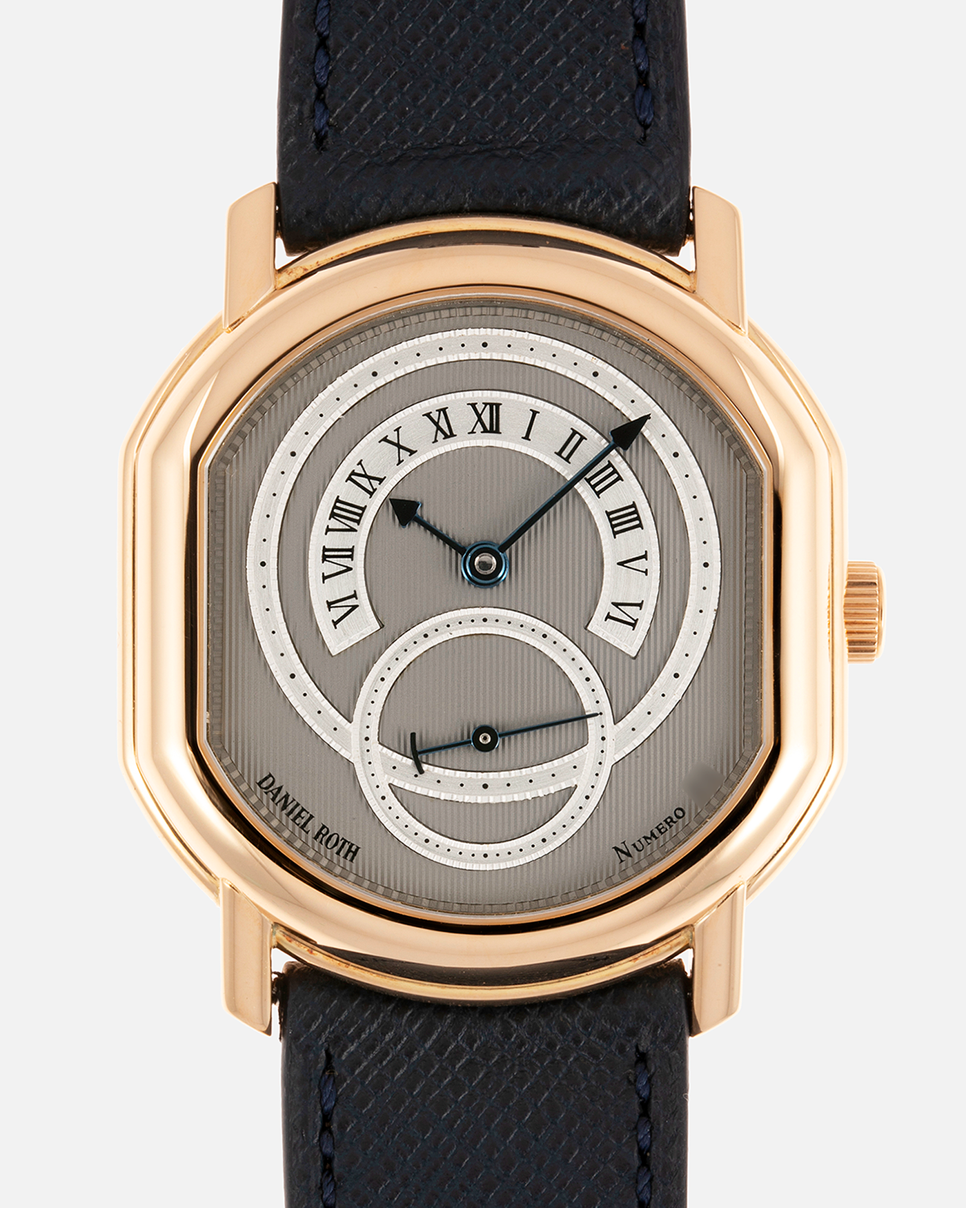 Brand: Daniel Roth Year: 1990’s Model: C127 Material: 18k Yellow Gold Movement: Lemania 27LN with Retrograde Function Case Diameter: 35mm X 38mm Strap: Molequin Navy Blue Textured Calf Strap and 18k Yellow Gold Daniel Roth Tang Buckle