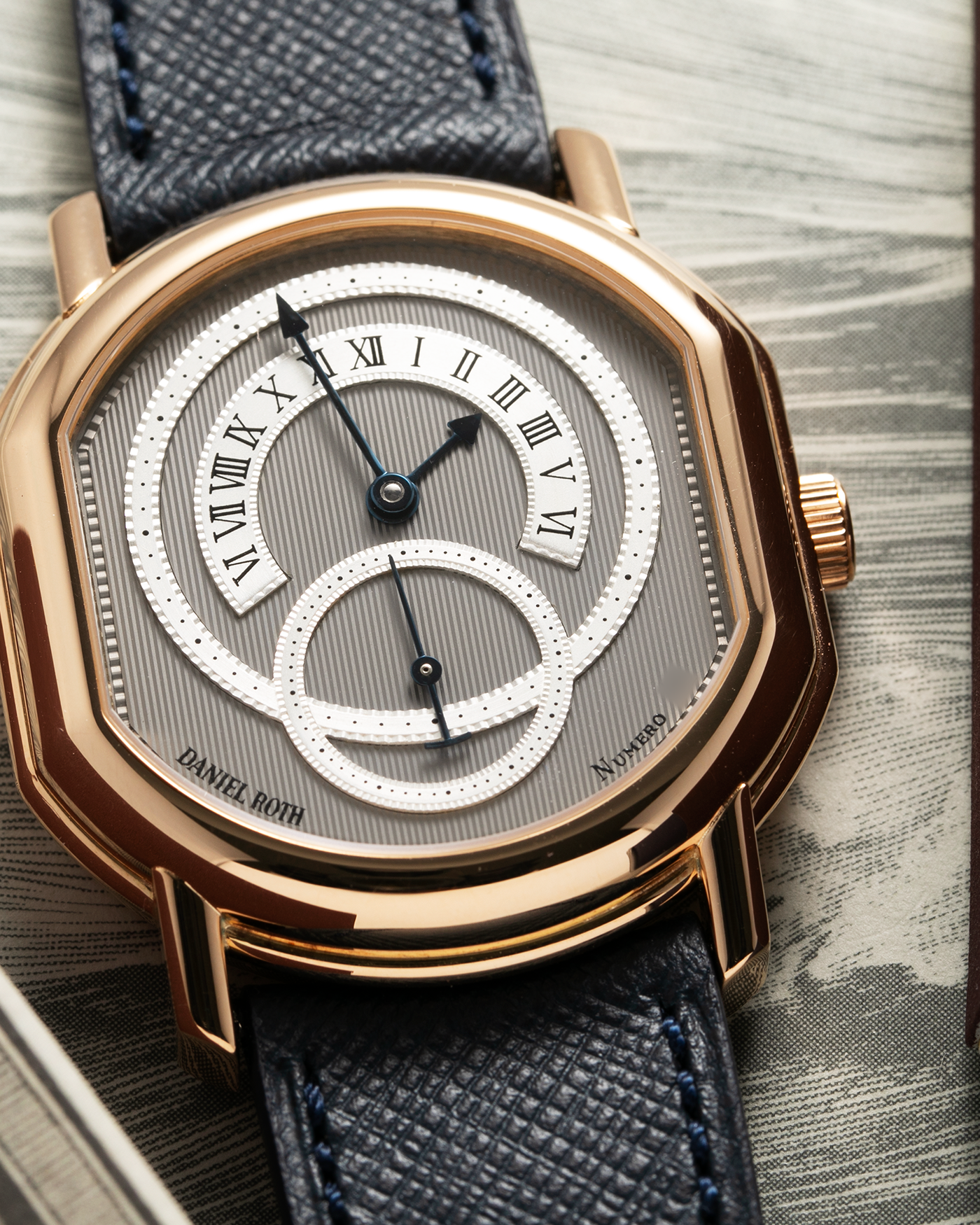 Brand: Daniel Roth Year: 1990’s Model: C127 Material: 18k Yellow Gold Movement: Lemania 27LN with Retrograde Function Case Diameter: 35mm X 38mm Strap: Molequin Navy Blue Textured Calf Strap and 18k Yellow Gold Daniel Roth Tang Buckle