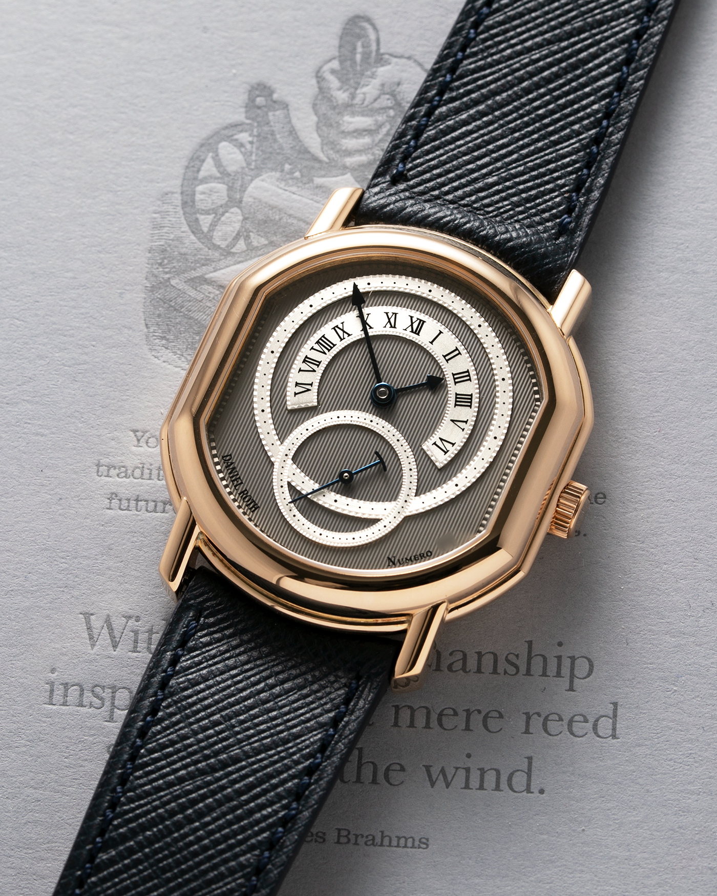 Brand: Daniel Roth Year: 1990’s Model: C127 Material: 18k Yellow Gold Movement: Lemania 27LN with Retrograde Function Case Diameter: 35mm X 38mm Strap: Molequin Navy Blue Textured Calf Strap and 18k Yellow Gold Daniel Roth Tang Buckle