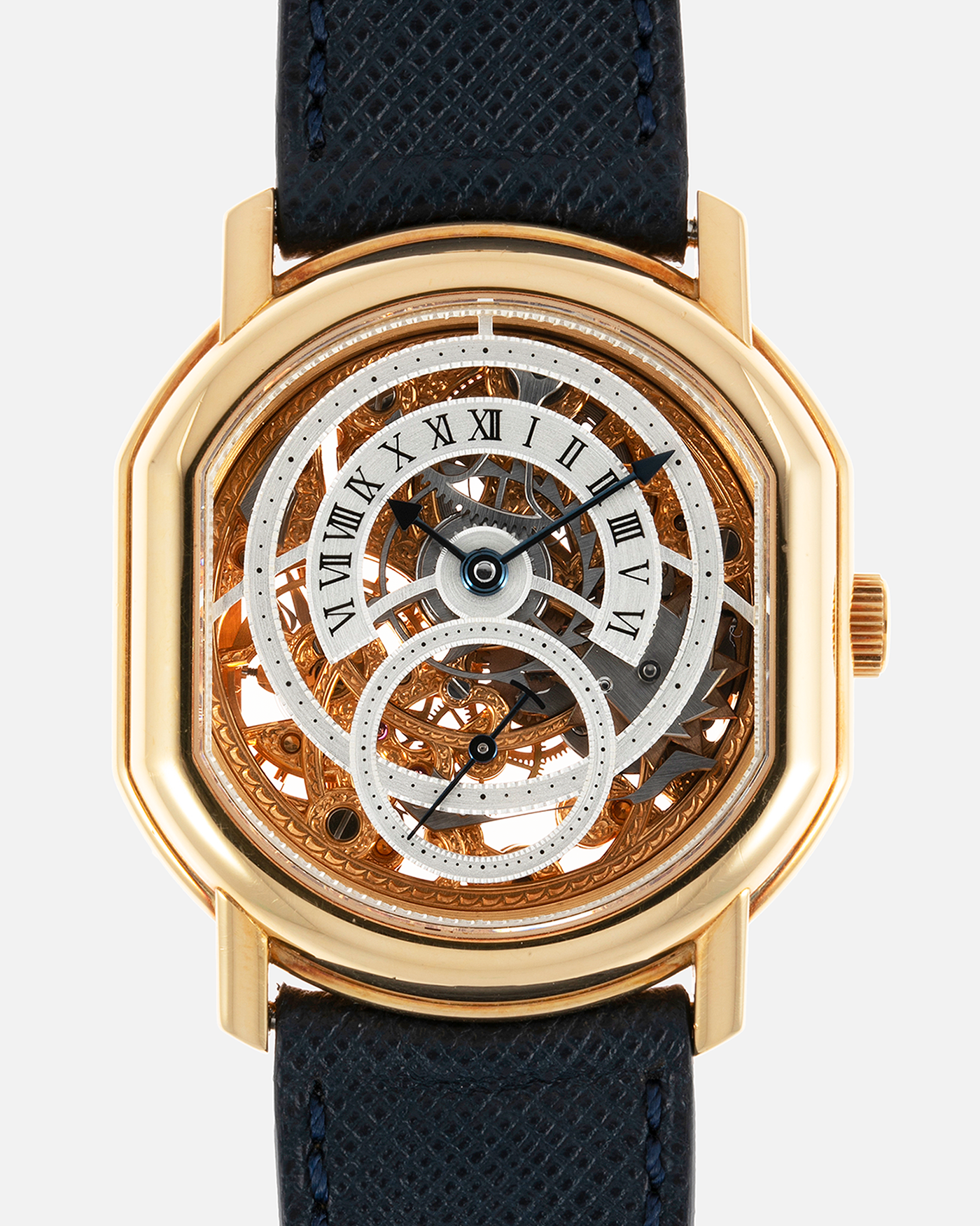 Brand: Daniel Roth Year: 1990’s Model: 2127 Skeleton Material: 18k Yellow Gold Movement: Lemania 27LN with Retrograde Function Case Diameter: 35mm X 38mm Strap: Molequin Navy Blue Textured Calf Strap and 18k Yellow Gold Daniel Roth Tang Buckle