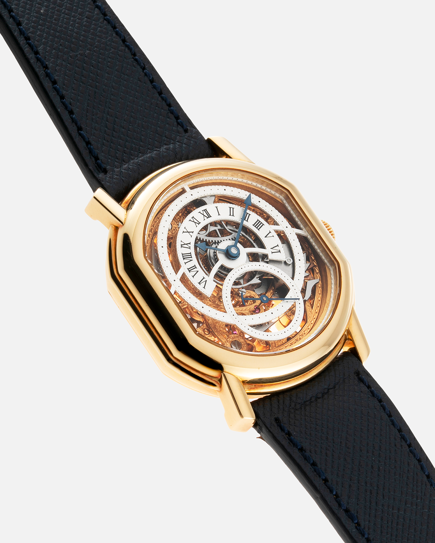 Brand: Daniel Roth Year: 1990’s Model: 2127 Skeleton Material: 18k Yellow Gold Movement: Lemania 27LN with Retrograde Function Case Diameter: 35mm X 38mm Strap: Molequin Navy Blue Textured Calf Strap and 18k Yellow Gold Daniel Roth Tang Buckle