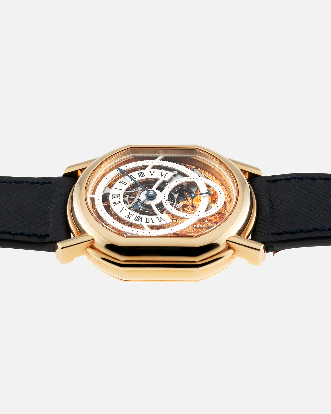 Brand: Daniel Roth Year: 1990’s Model: 2127 Skeleton Material: 18k Yellow Gold Movement: Lemania 27LN with Retrograde Function Case Diameter: 35mm X 38mm Strap: Molequin Navy Blue Textured Calf Strap and 18k Yellow Gold Daniel Roth Tang Buckle