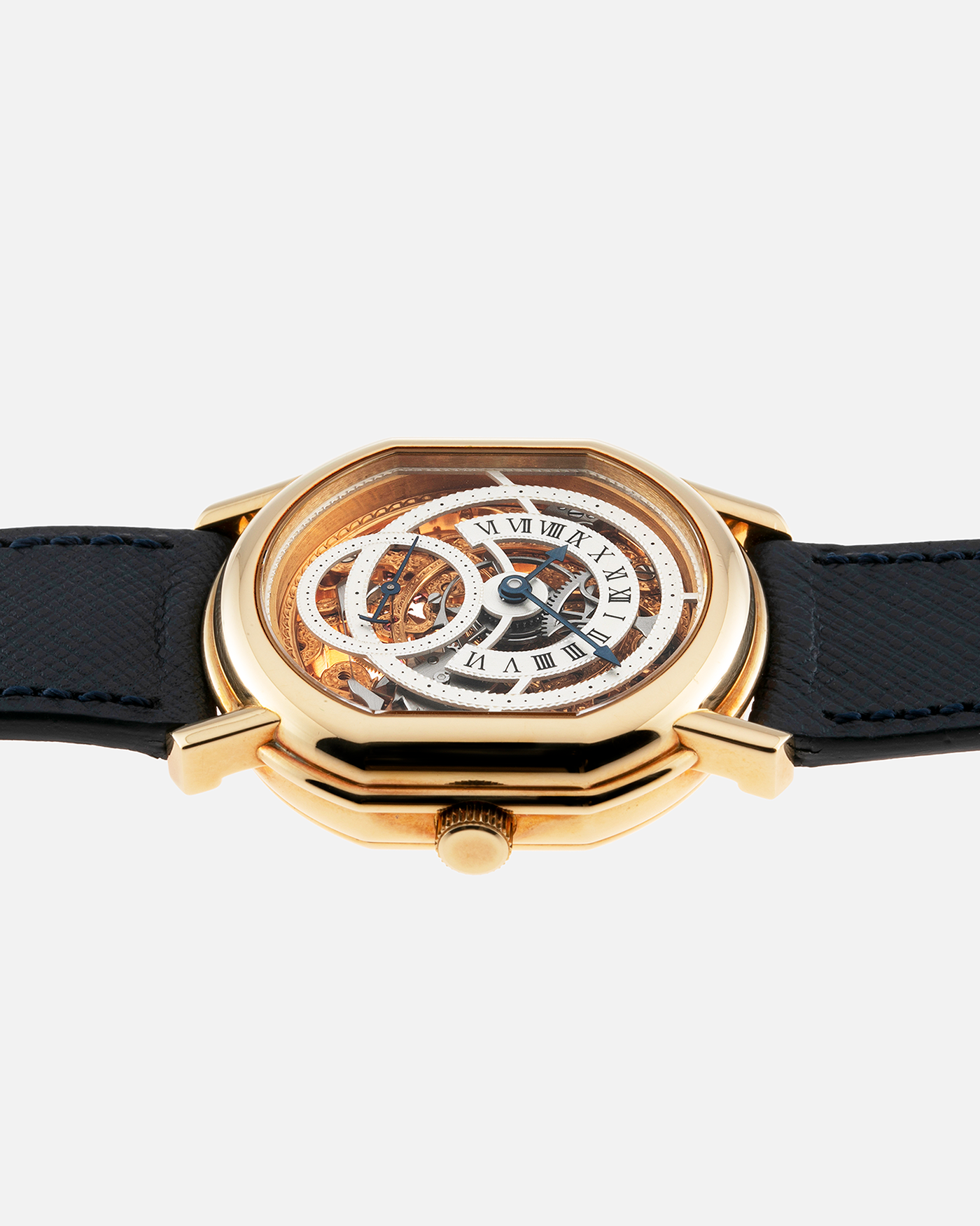 Brand: Daniel Roth Year: 1990’s Model: 2127 Skeleton Material: 18k Yellow Gold Movement: Lemania 27LN with Retrograde Function Case Diameter: 35mm X 38mm Strap: Molequin Navy Blue Textured Calf Strap and 18k Yellow Gold Daniel Roth Tang Buckle