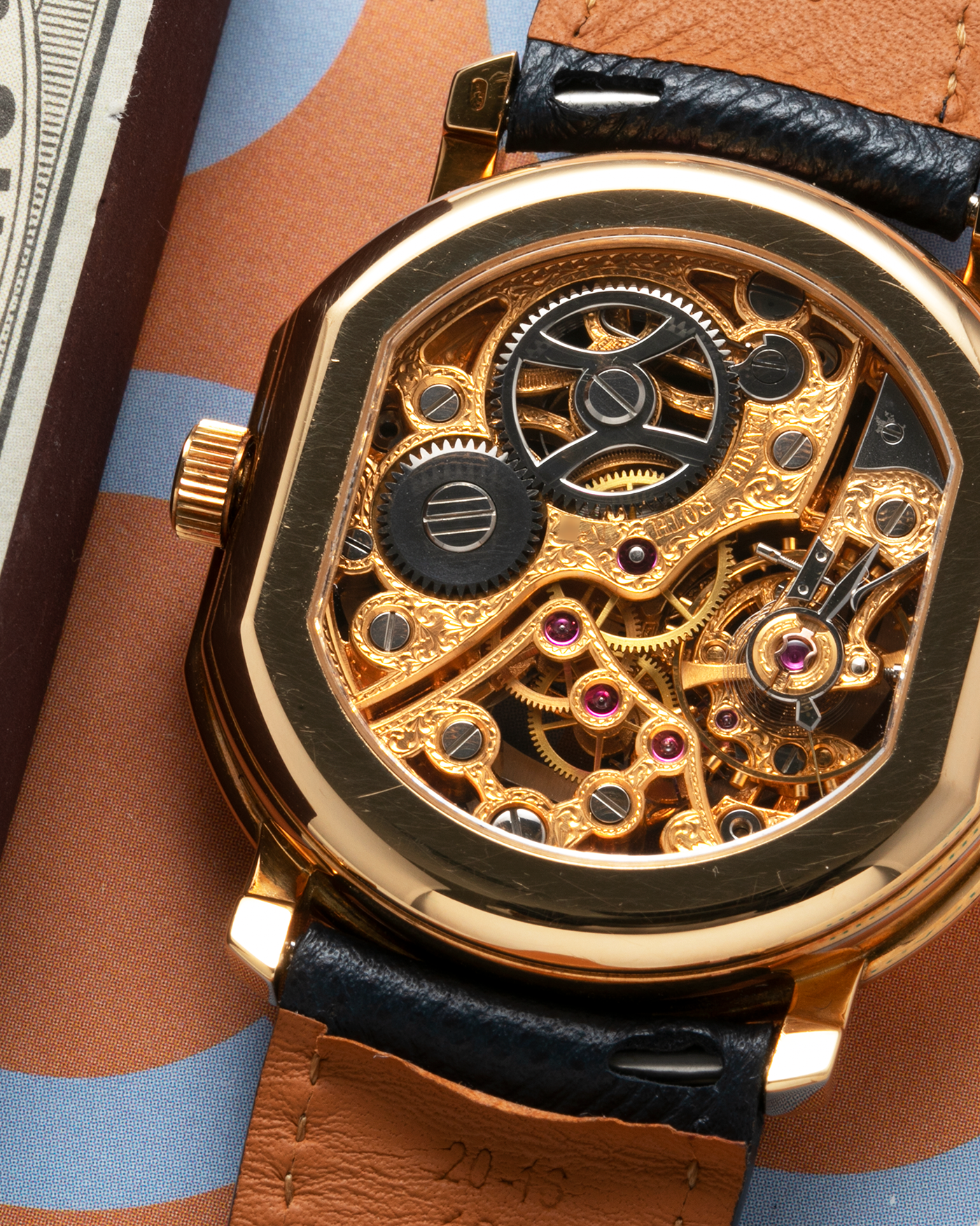 Brand: Daniel Roth Year: 1990’s Model: 2127 Skeleton Material: 18k Yellow Gold Movement: Lemania 27LN with Retrograde Function Case Diameter: 35mm X 38mm Strap: Molequin Navy Blue Textured Calf Strap and 18k Yellow Gold Daniel Roth Tang Buckle