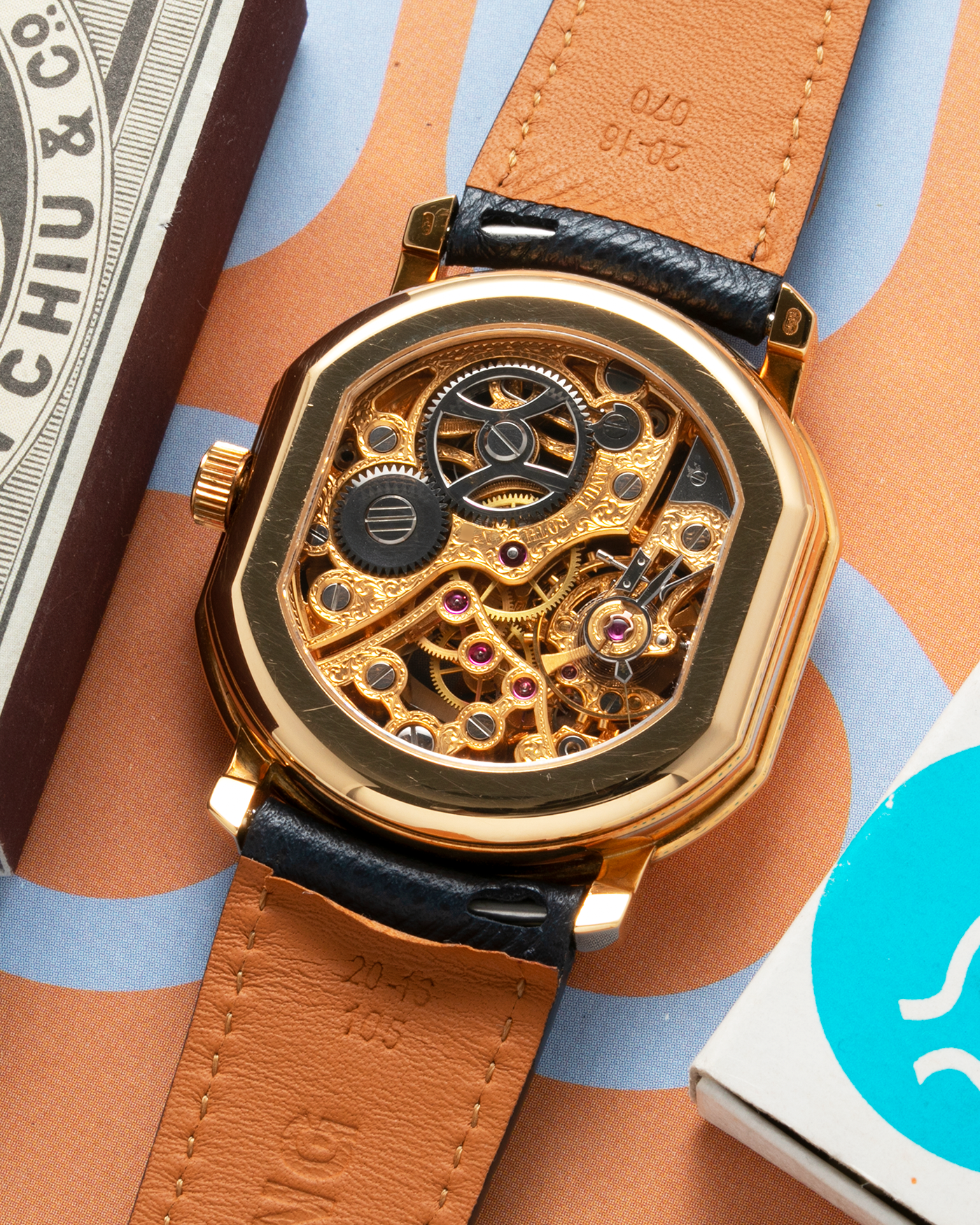 Brand: Daniel Roth Year: 1990’s Model: 2127 Skeleton Material: 18k Yellow Gold Movement: Lemania 27LN with Retrograde Function Case Diameter: 35mm X 38mm Strap: Molequin Navy Blue Textured Calf Strap and 18k Yellow Gold Daniel Roth Tang Buckle
