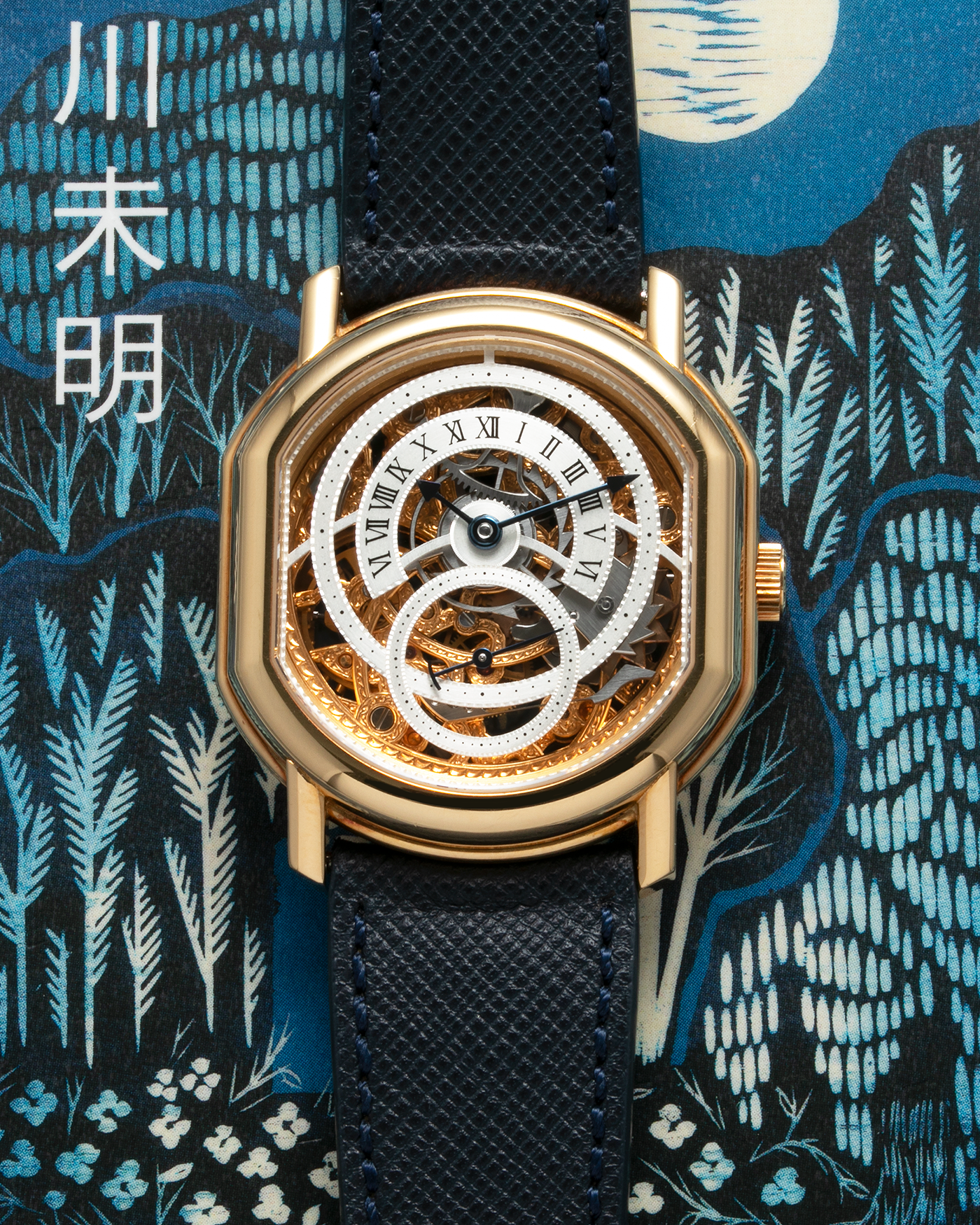 Brand: Daniel Roth Year: 1990’s Model: 2127 Skeleton Material: 18k Yellow Gold Movement: Lemania 27LN with Retrograde Function Case Diameter: 35mm X 38mm Strap: Molequin Navy Blue Textured Calf Strap and 18k Yellow Gold Daniel Roth Tang Buckle