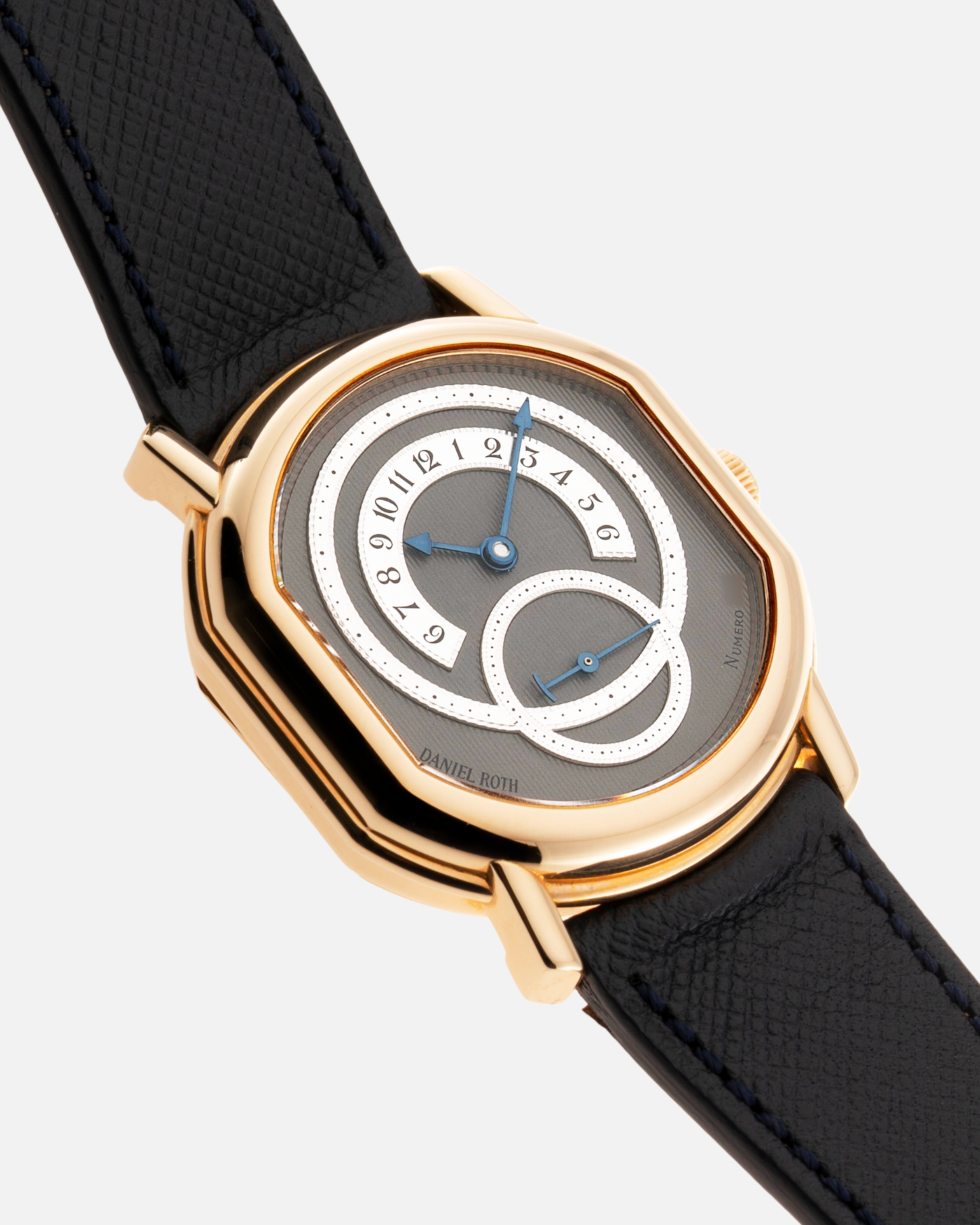 Brand: Daniel Roth Year: 1990’s Model: C127 Material: 18k Yellow Gold Movement: Lemania 27LN with Retrograde Function Case Diameter: 35mm X 38mm Strap: Molequin Navy Blue Textured Calf Strap and 18k Yellow Gold Daniel Roth Tang Buckle