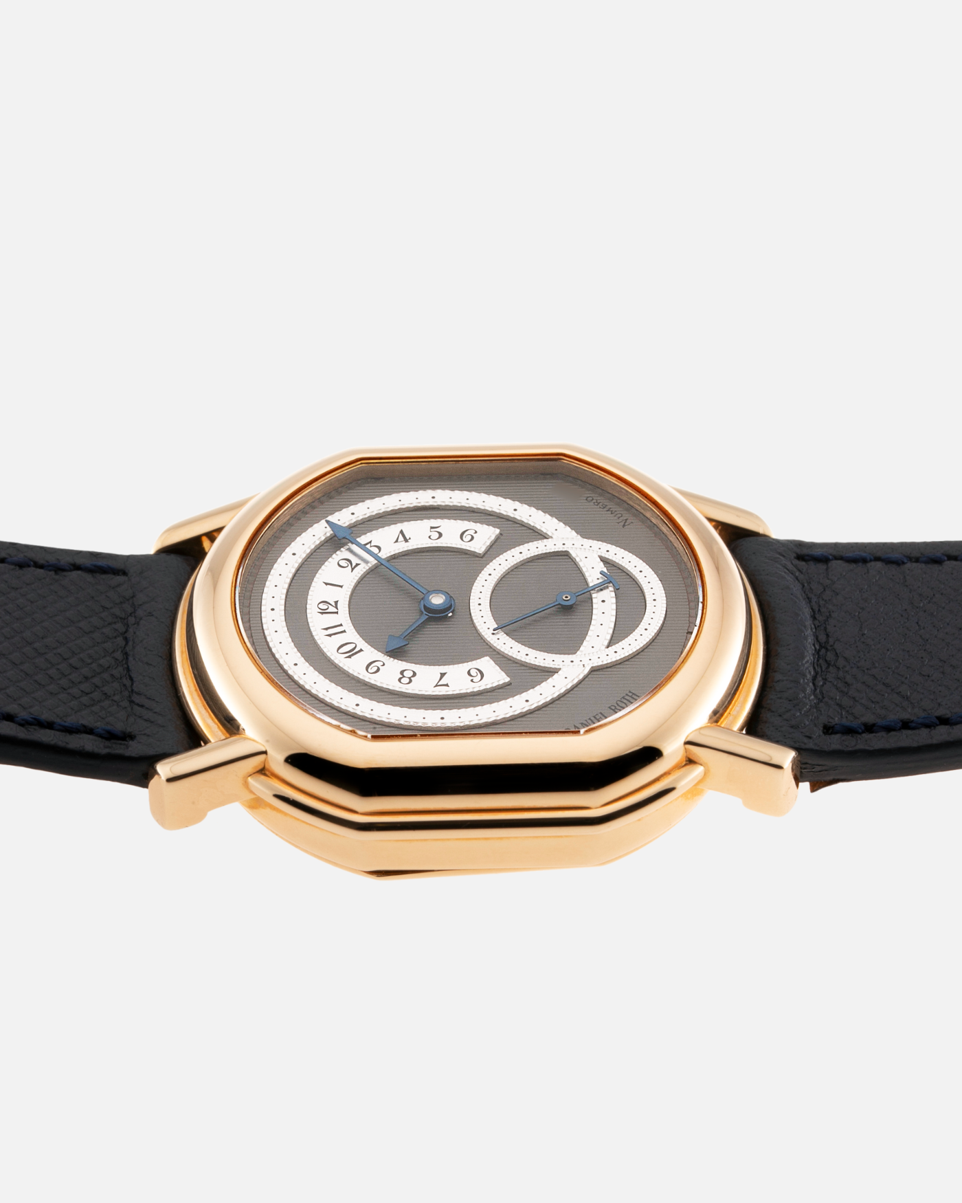 Brand: Daniel Roth Year: 1990’s Model: C127 Material: 18k Yellow Gold Movement: Lemania 27LN with Retrograde Function Case Diameter: 35mm X 38mm Strap: Molequin Navy Blue Textured Calf Strap and 18k Yellow Gold Daniel Roth Tang Buckle